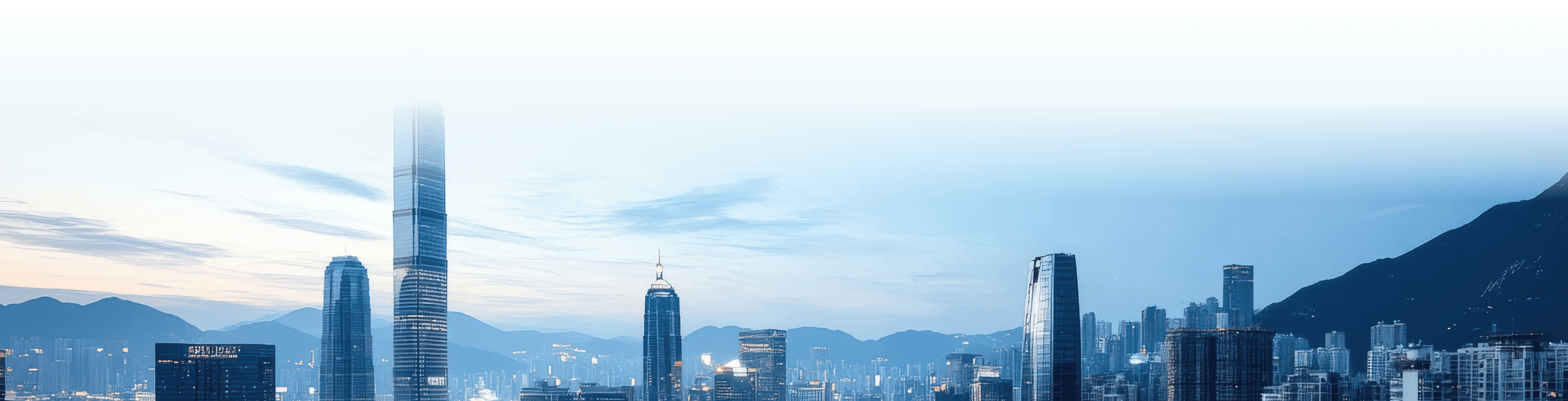 Panoramic view of a modern city skyline with elevated highways in the foreground.