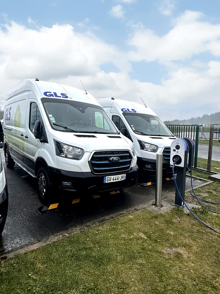 a man pumping gas into his car at a gas station