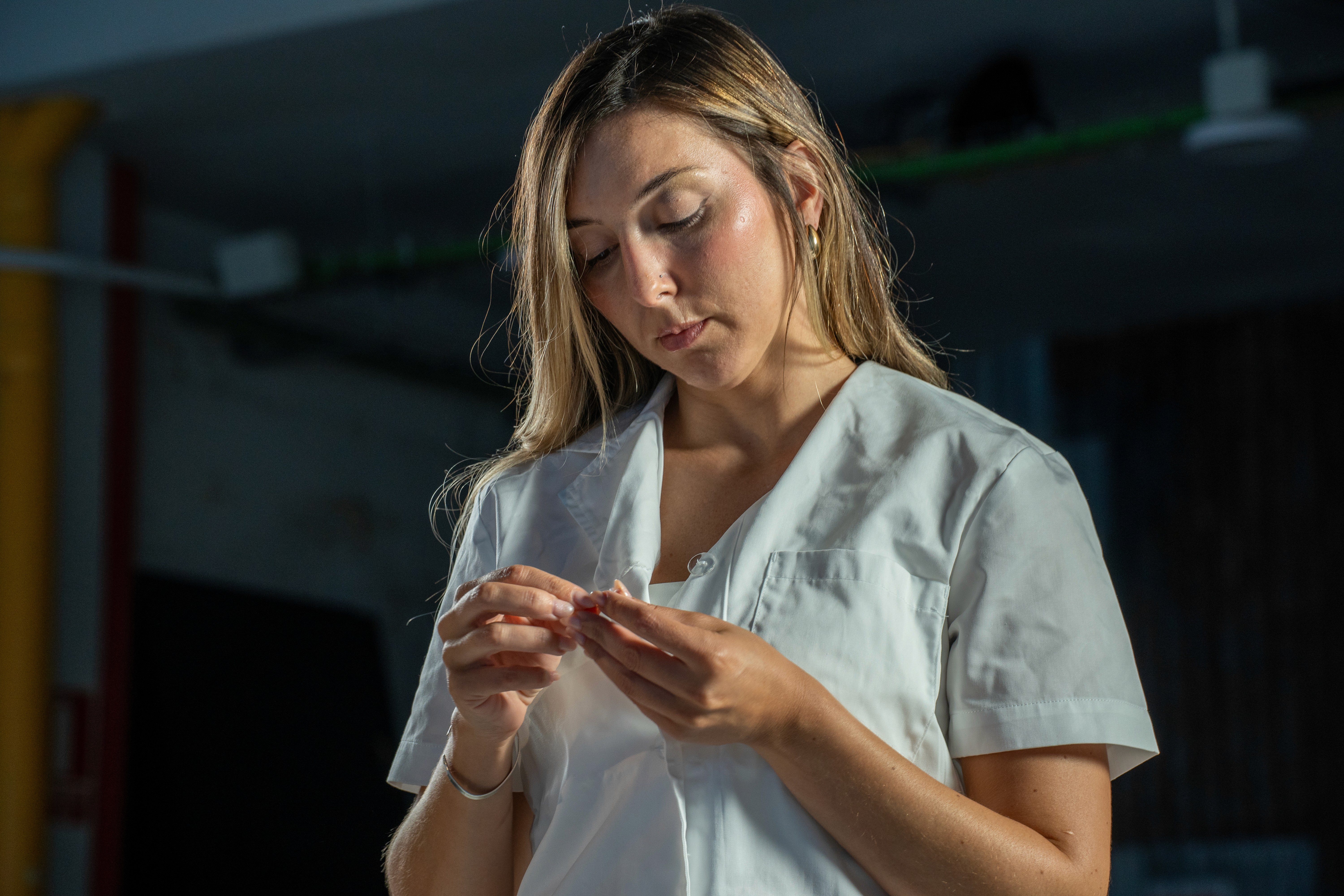 Cosmetologist performing a facial treatment on a relaxed client in a spa setting