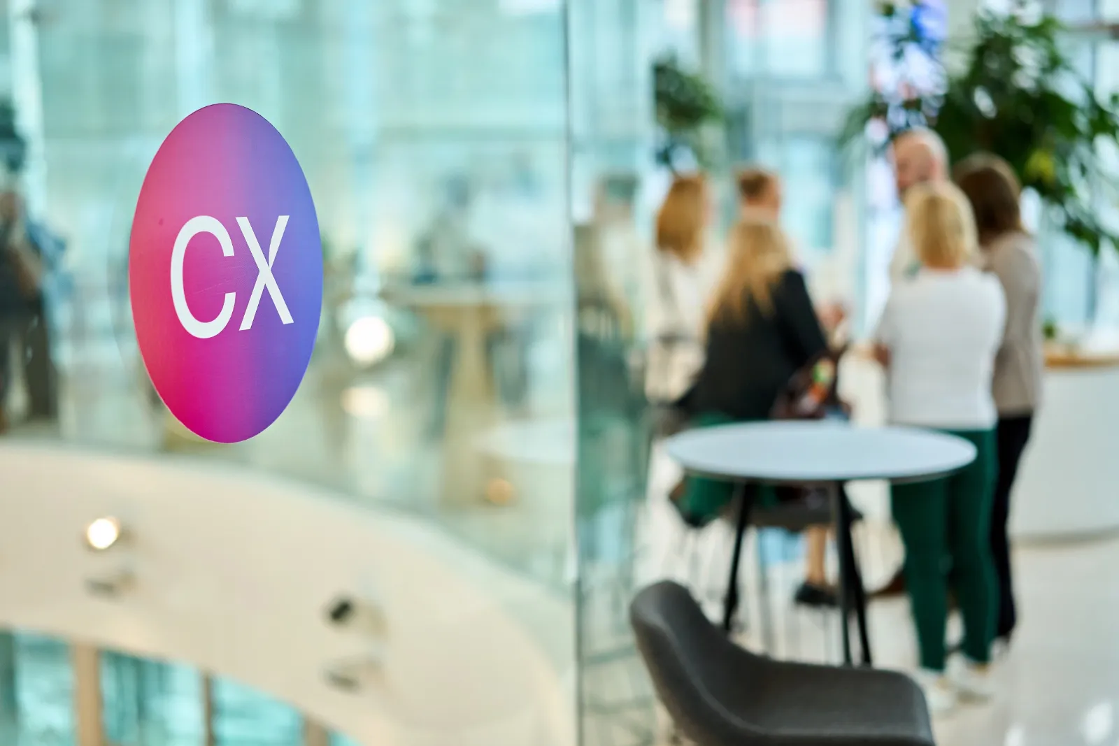 CX Day conference, networking area with the CX logo