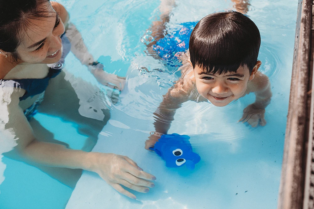Parent and child enjoying warm water together