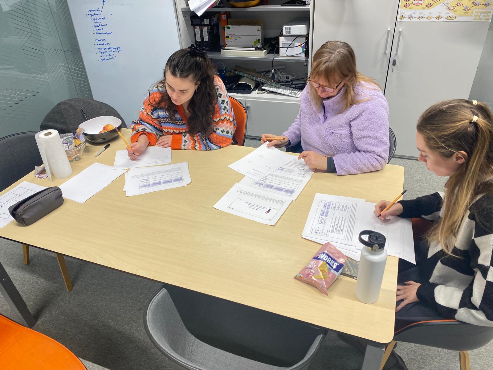 Here's a possible caption: abstract red shapes swirl with tiny, white specks.