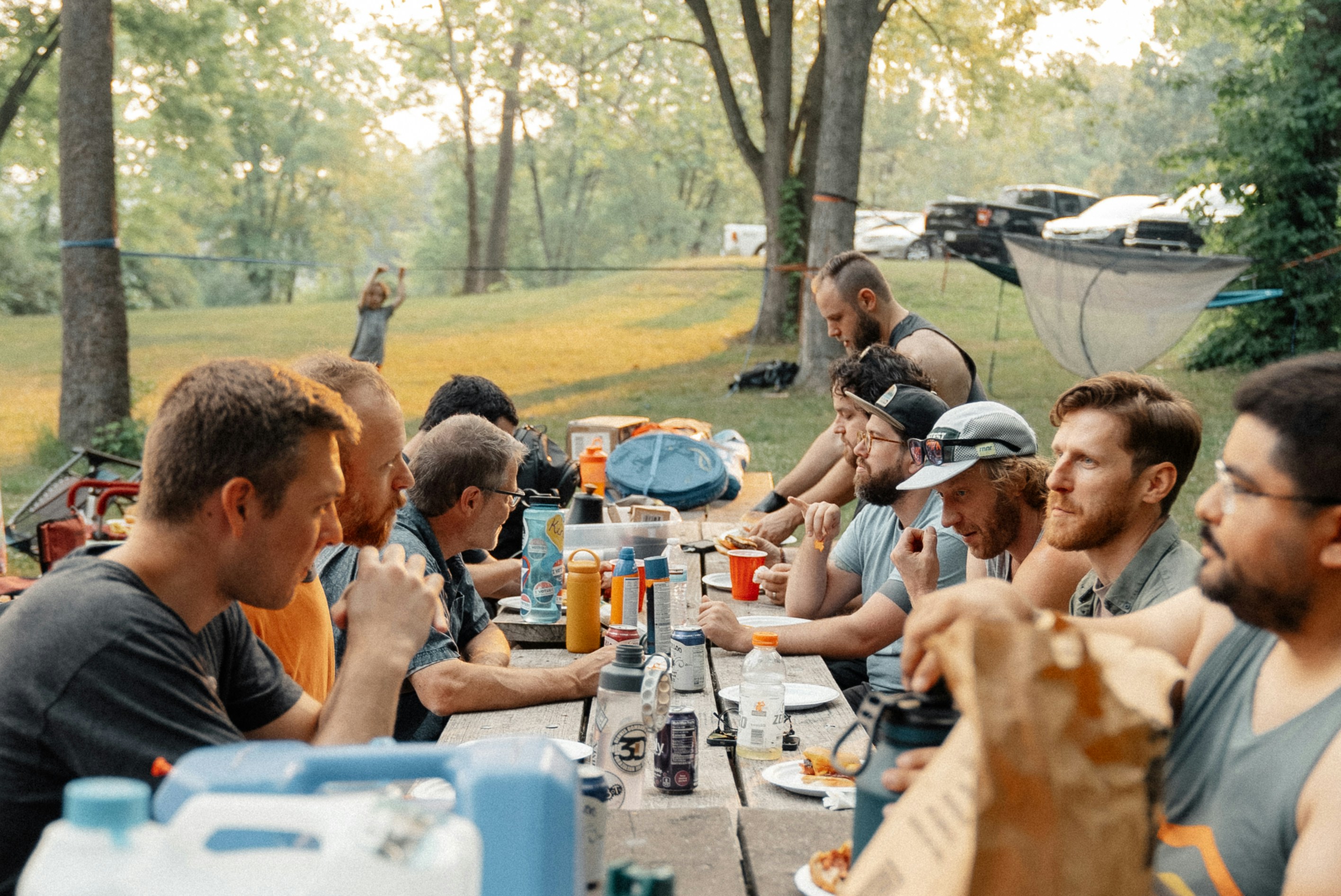 Men eating at a table outside