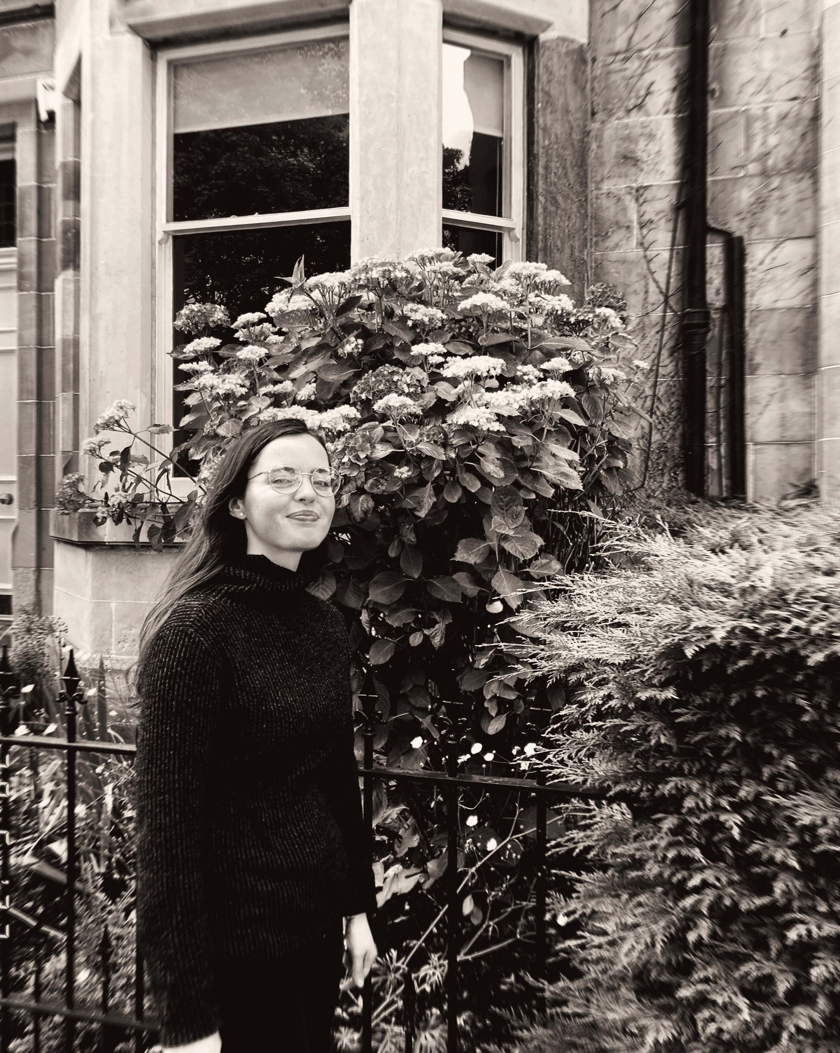 a blurry photo of a person standing in front of a wall