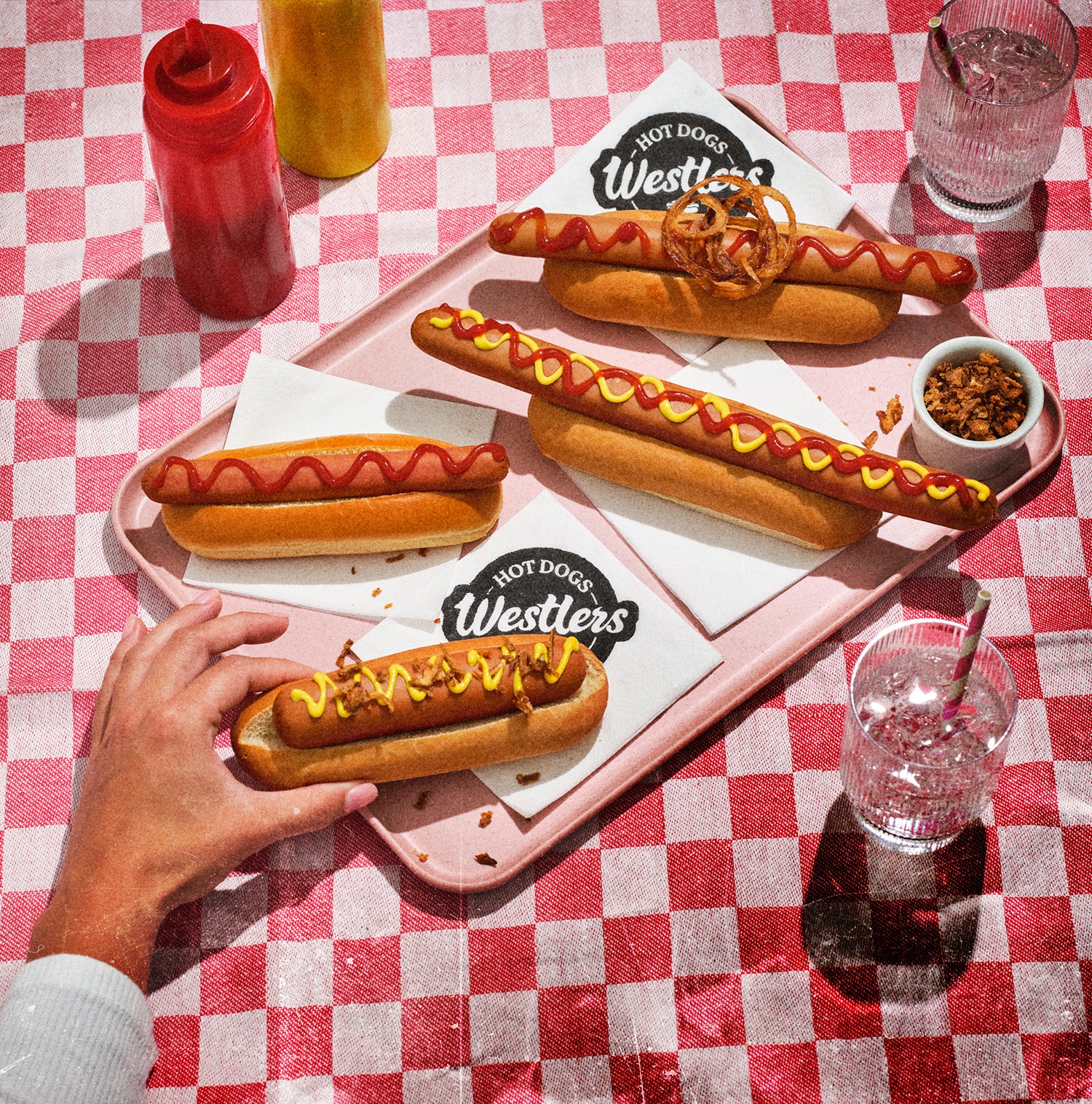 4 hotdogs on a table