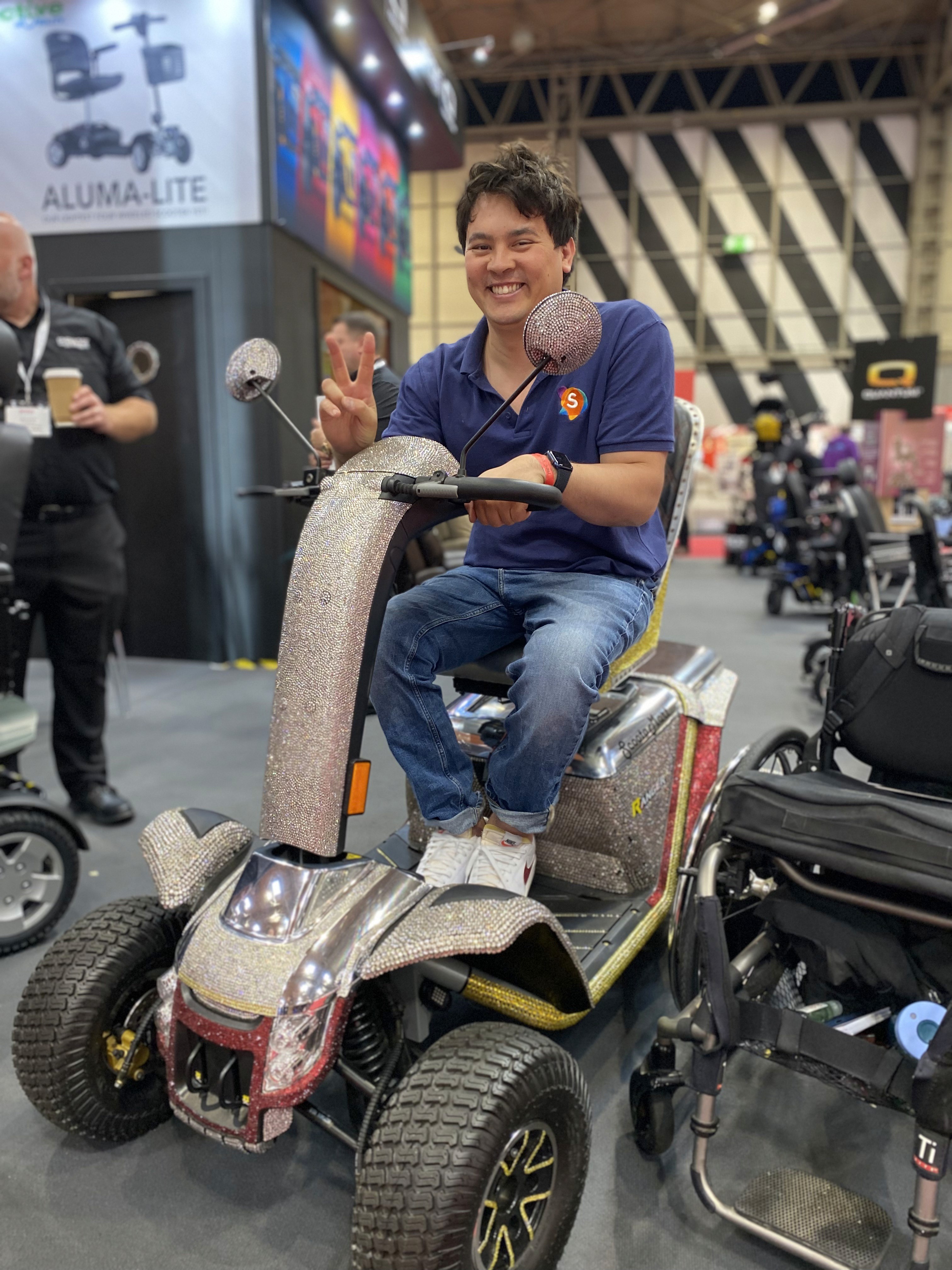 Matt Pierri at the 2021 Naidex event trying a mobility scooter