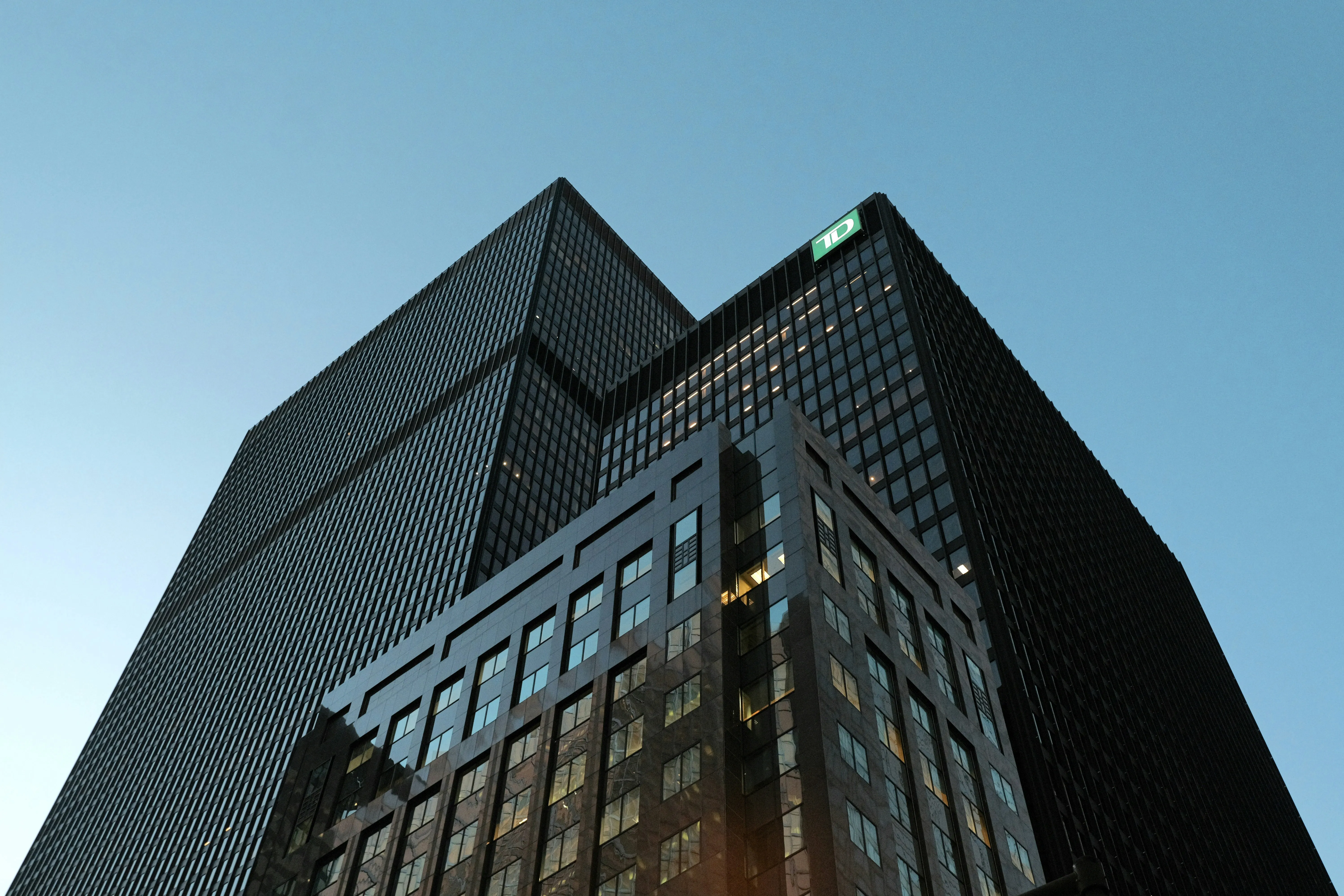 Modern skyscrapers against a clear blue sky.