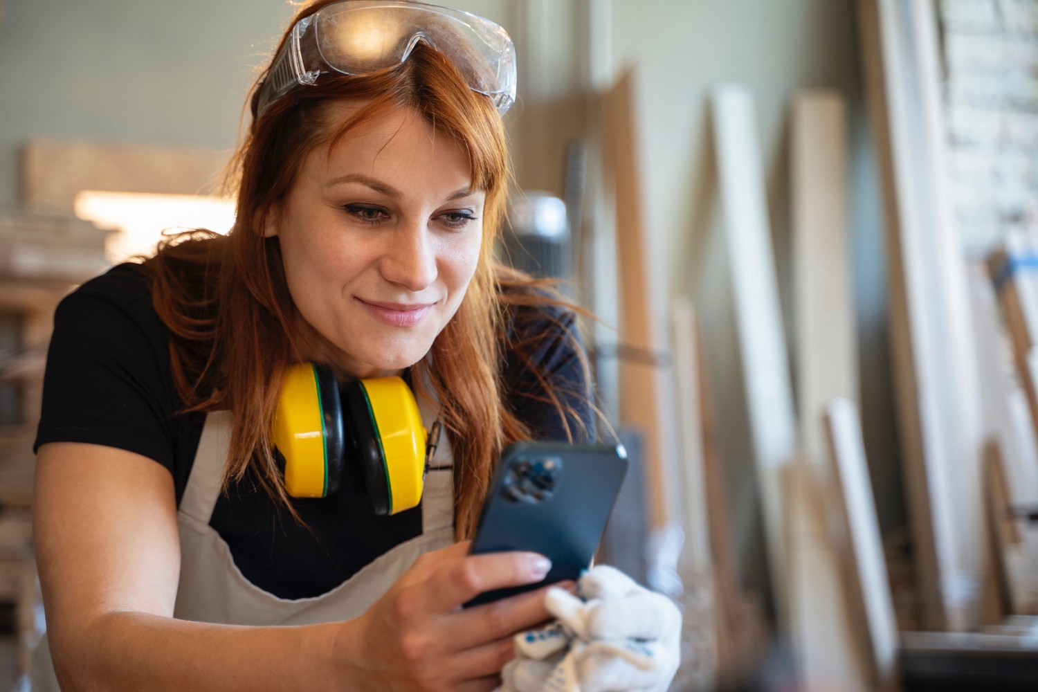 Professional using a tablet to control building maintenance and service workflows.