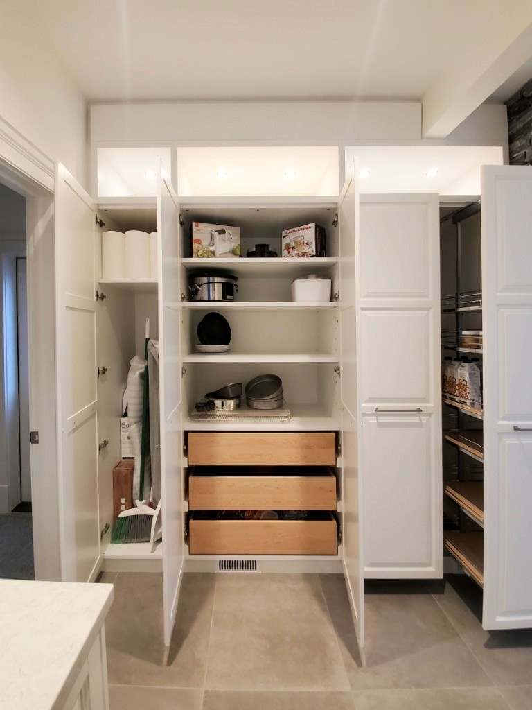 Image of Kitchen pantry with custom cabinetry, shelving, and drawers for organized storage and home design solutions by KHD Homes.