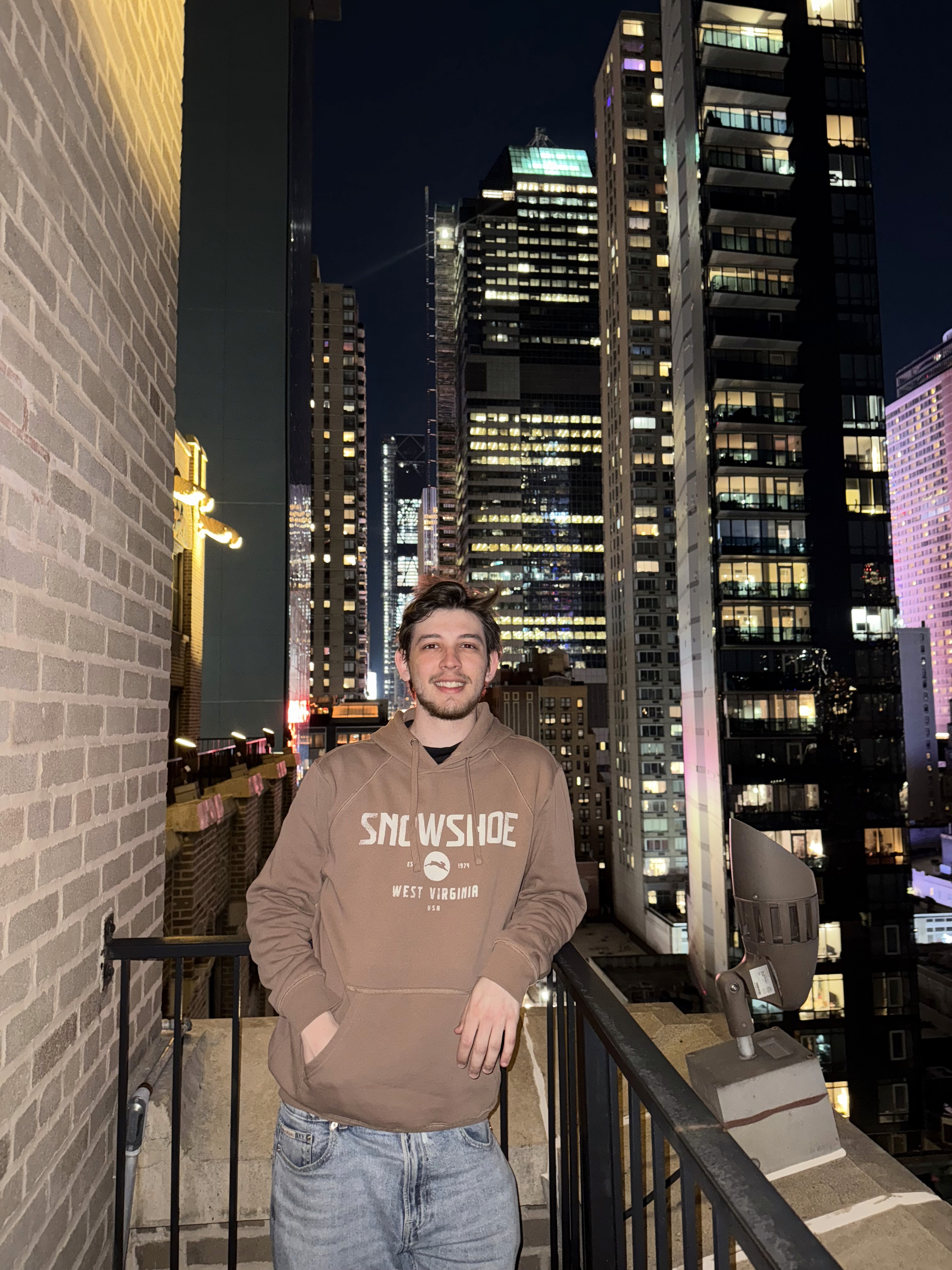 A white man in a highlight of a building in NY