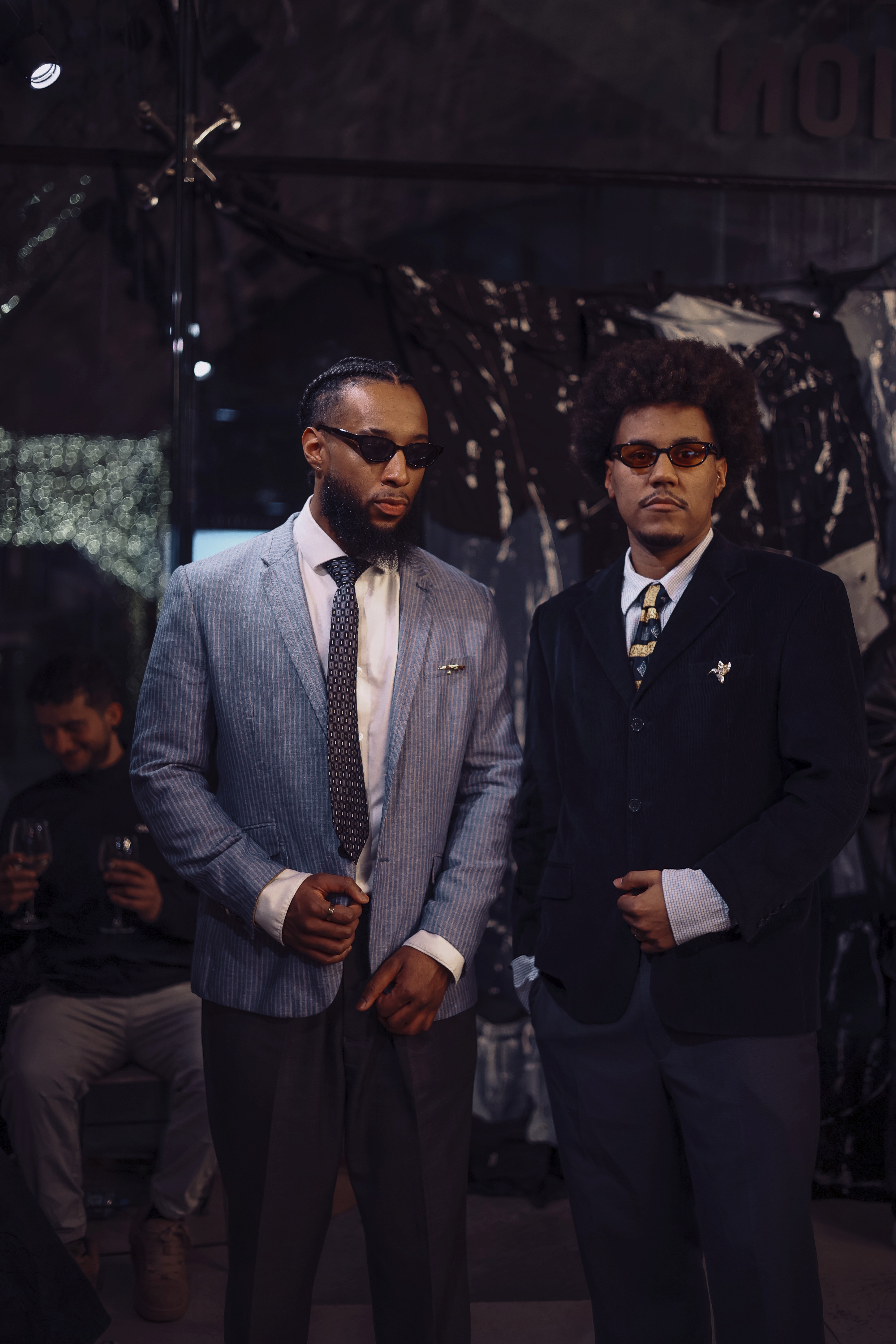 a woman in a dress sitting on a couch