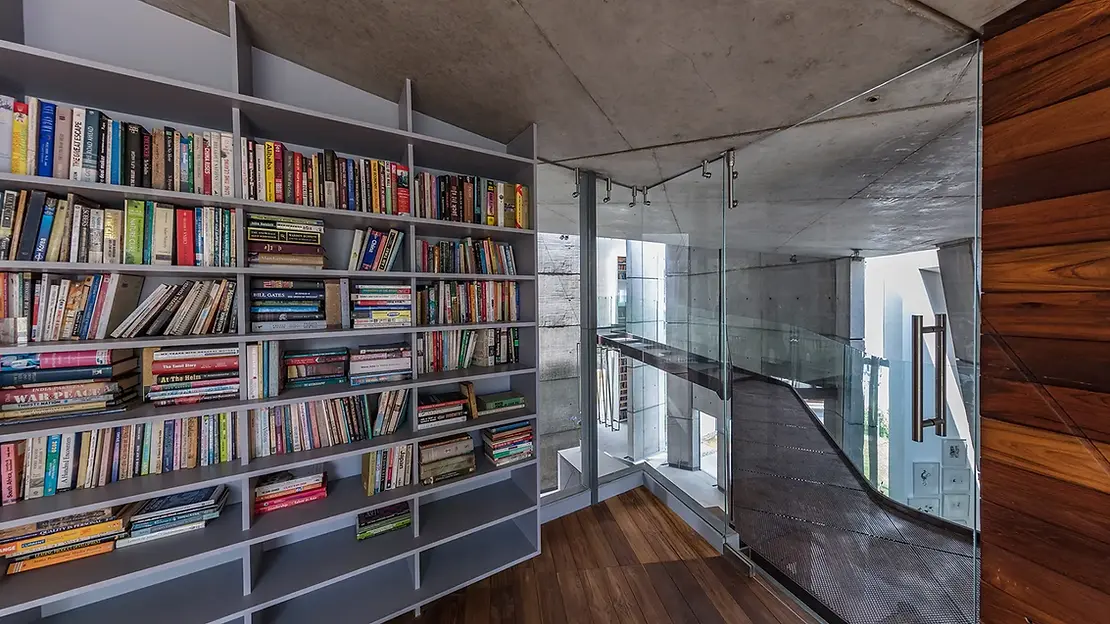 Image of the library or reading room and an image of the metal and glass bridge