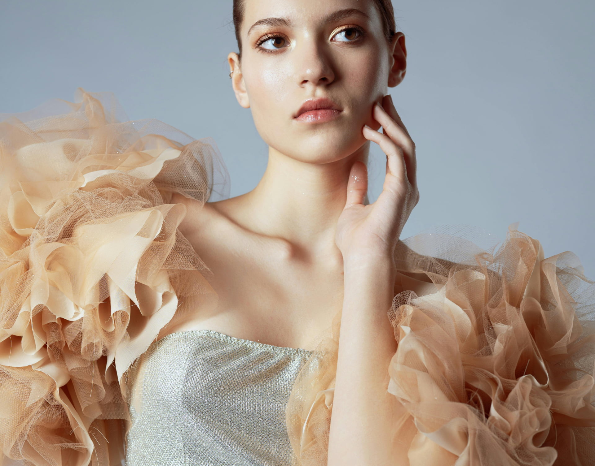 Fashion photoshoot with a woman posing in a dress