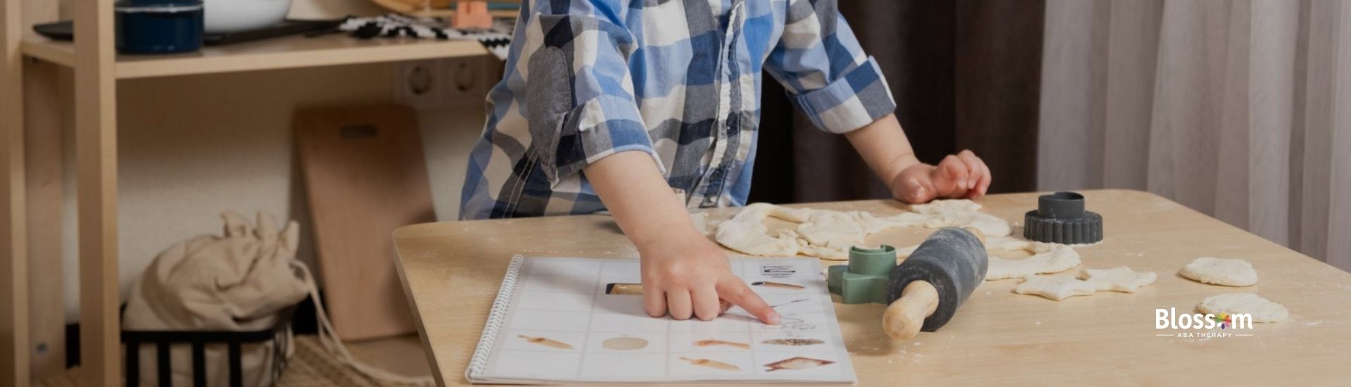 A boy labeling and pointing at a task chart.