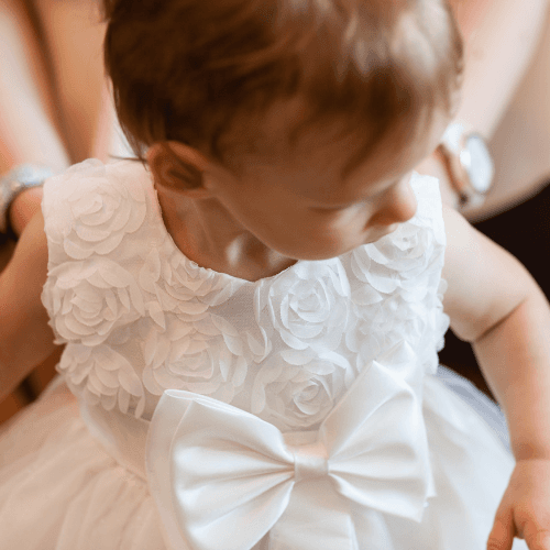 Smiling baby in Christening Gown