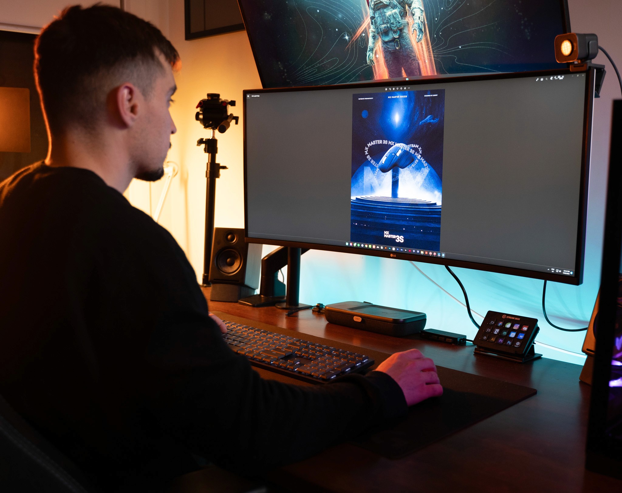 Two men discuss a project while standing at a laptop in an office.
