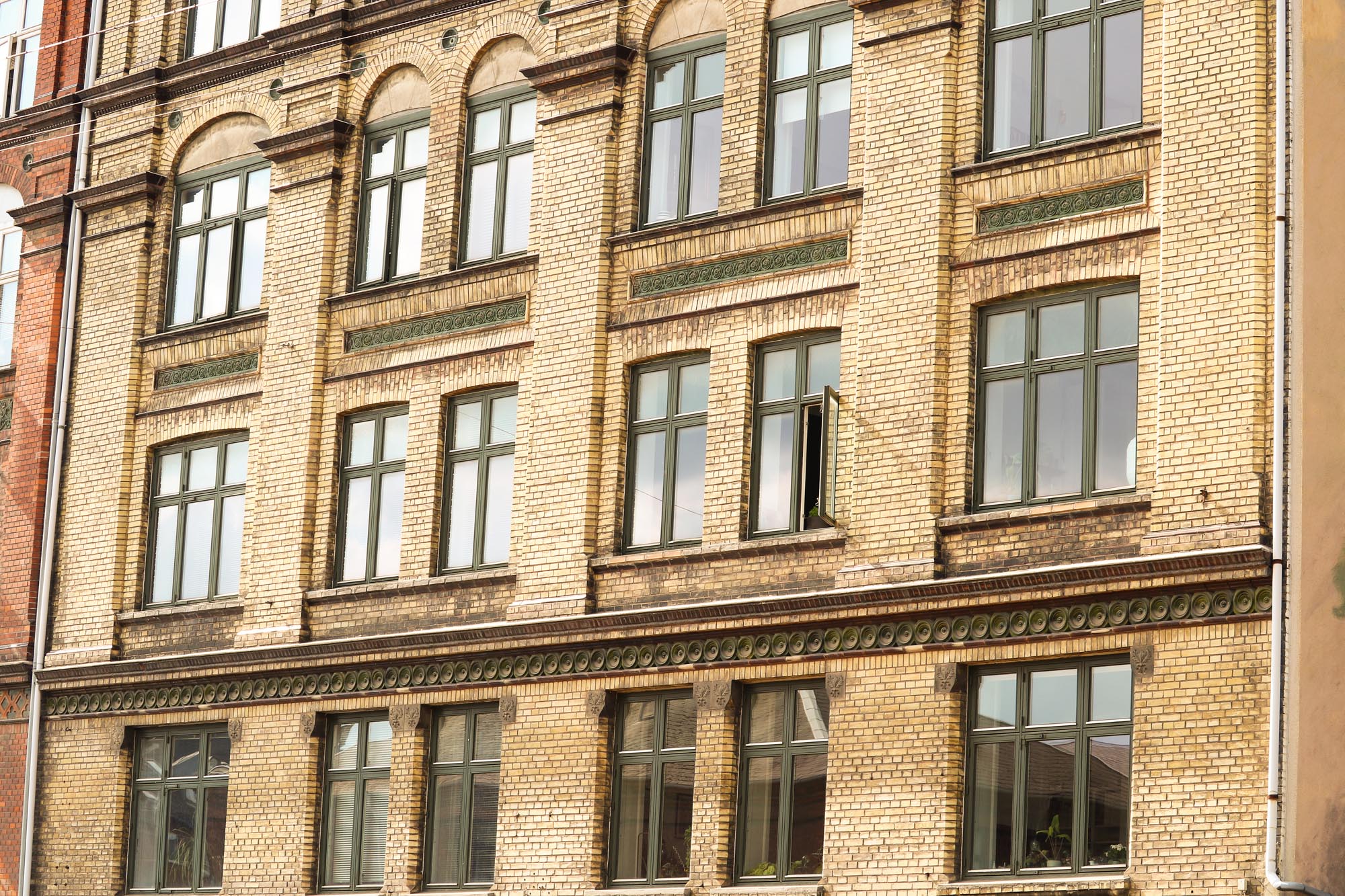 cars on road near buildings during daytime