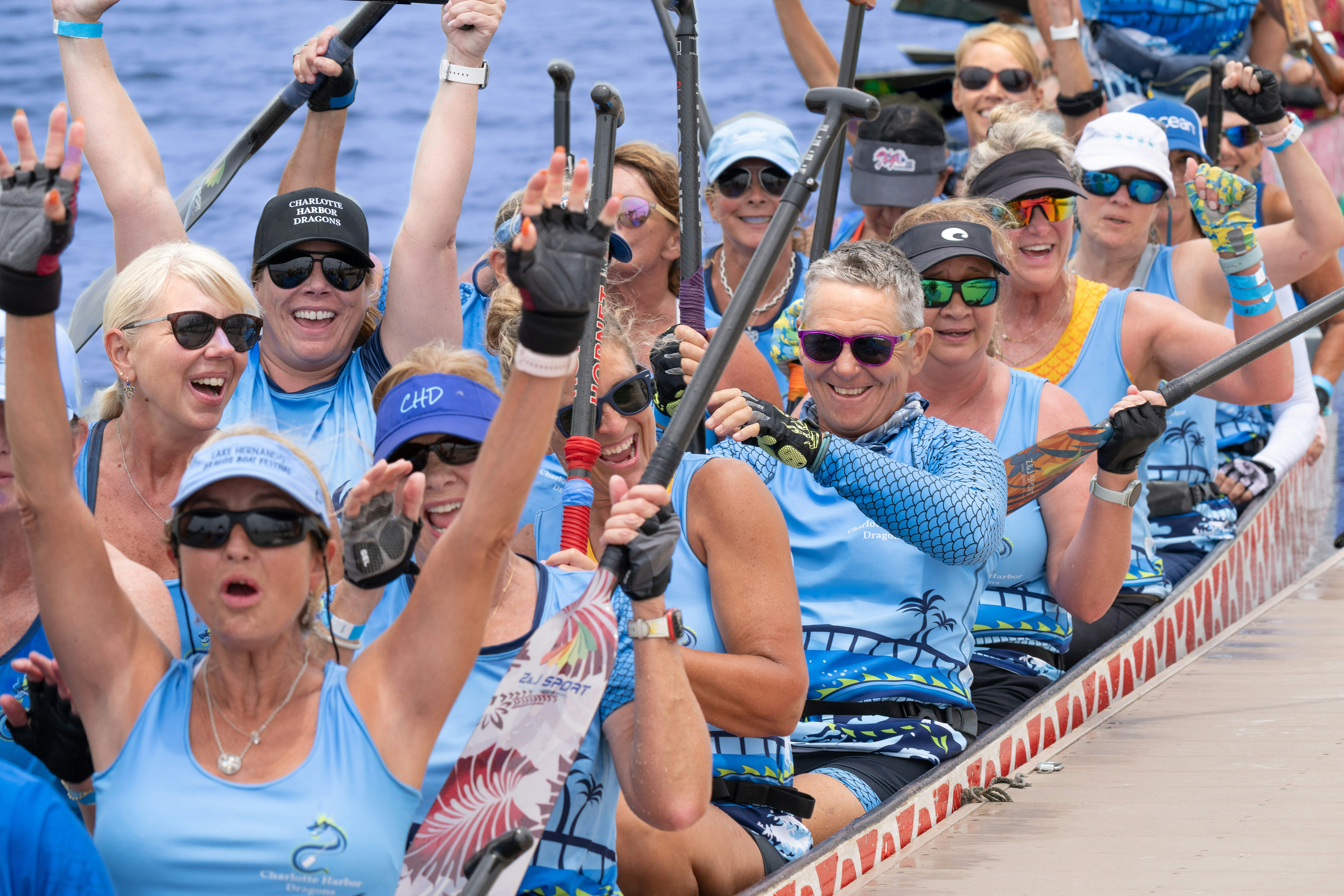 A dragon boat team celebrates their victory.