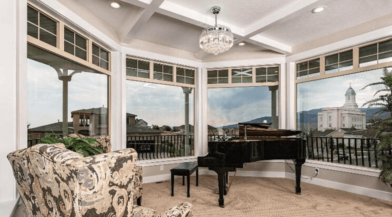 a man in a yellow shirt is working on a roof
