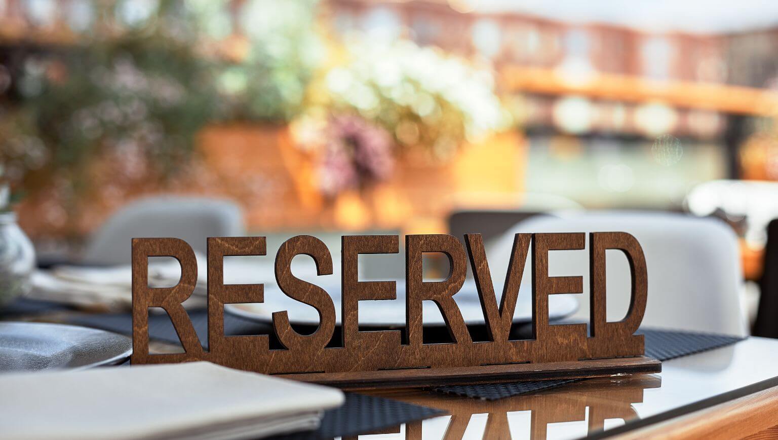 brown wooden kitchen cupboard near wall