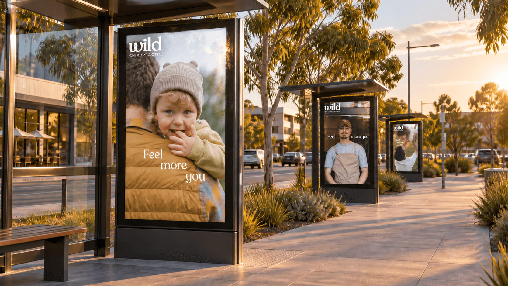 Feel More You campaign shown across three Wild Chiropractic digital outdoor advertising displays in an Australian streetscape
