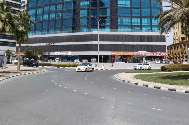 Close-up of the commercial entrance at Apricot Tower, showcasing prime business location and visibility.