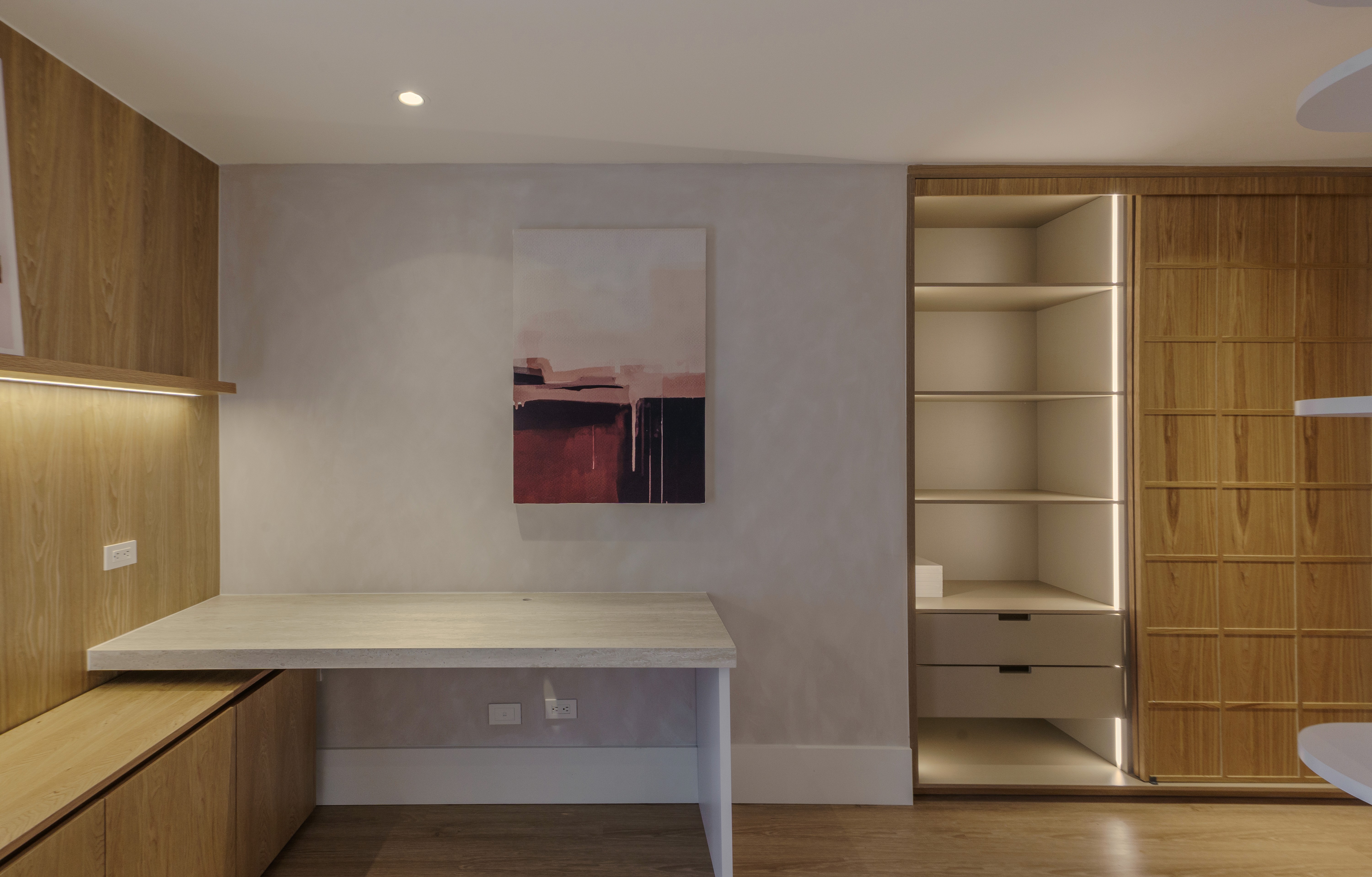 Double-height interior with flowing sculptural forms and warm raking light