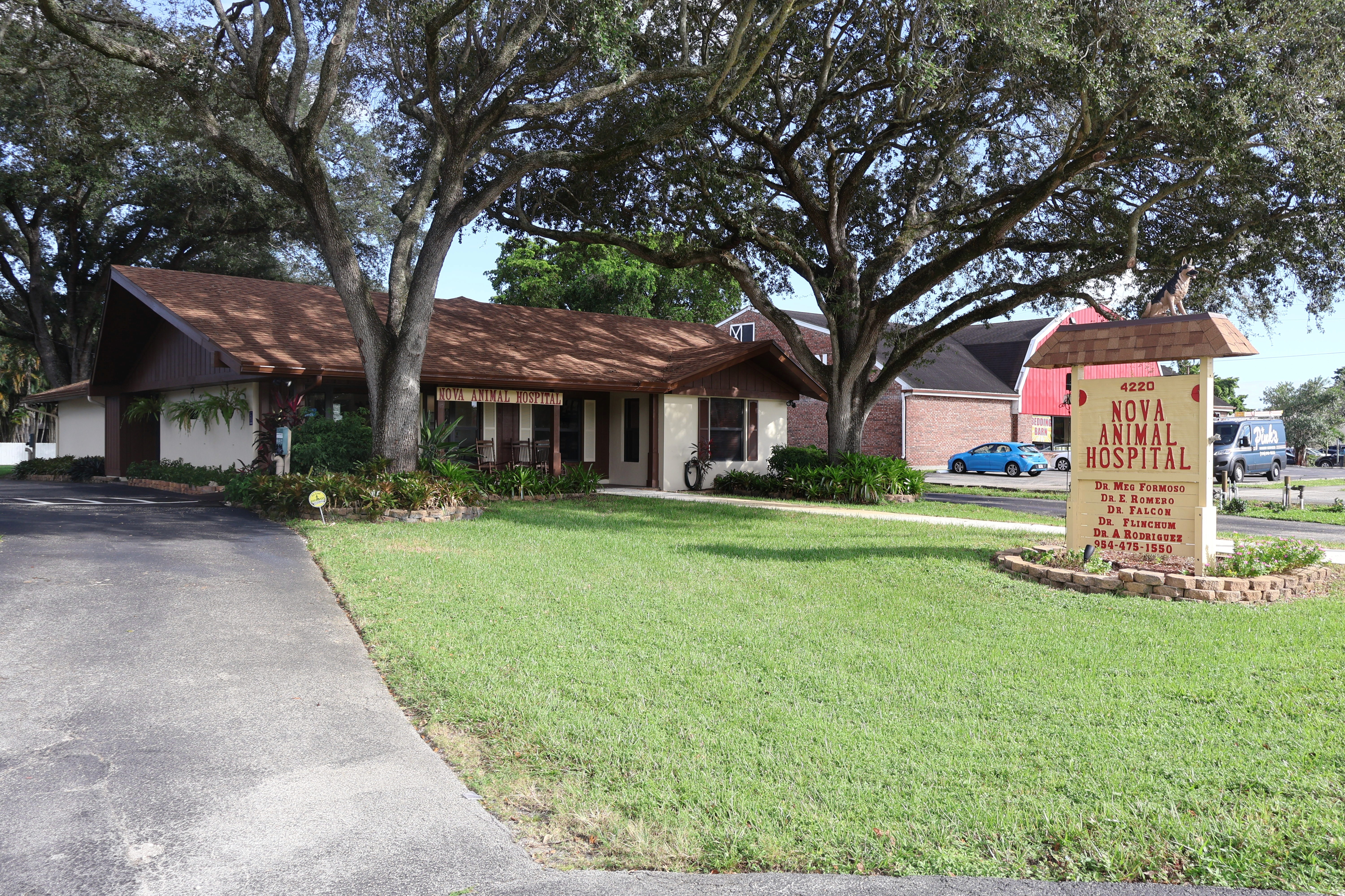 wide view of the hospital with the sign in front of it
