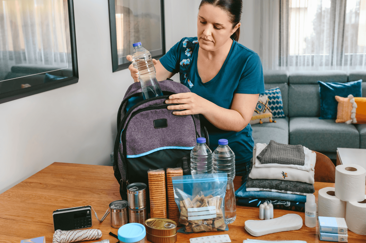 Woman Preparing an Emergency Kit