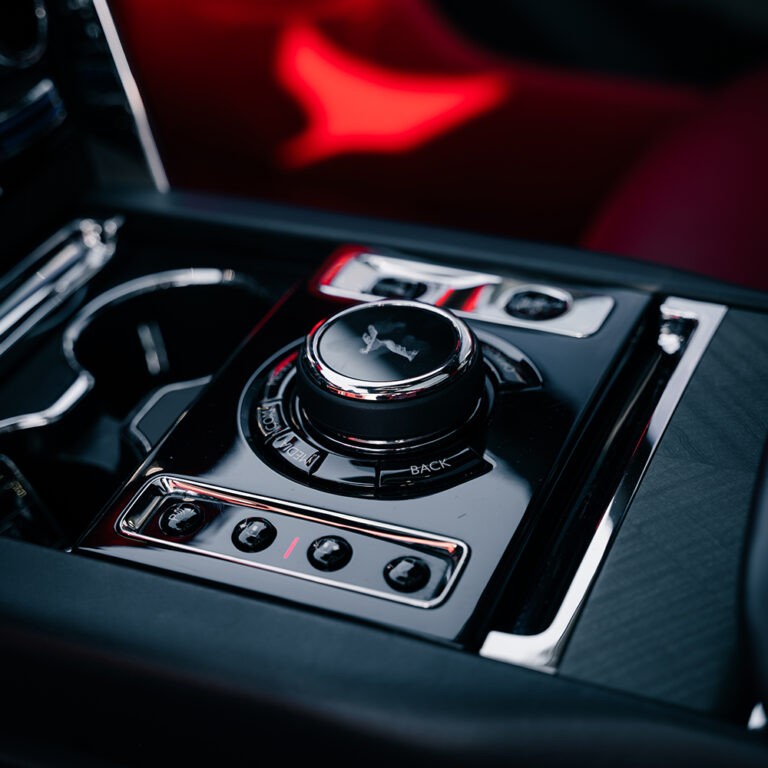 Rolls-Royce Cullinan center console, red leather trim, premium cabin experience.