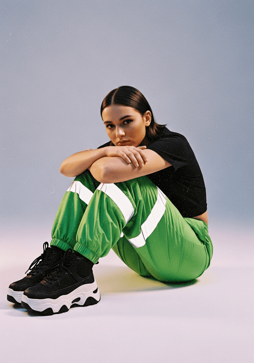 Stylish model posing with wearing shoes