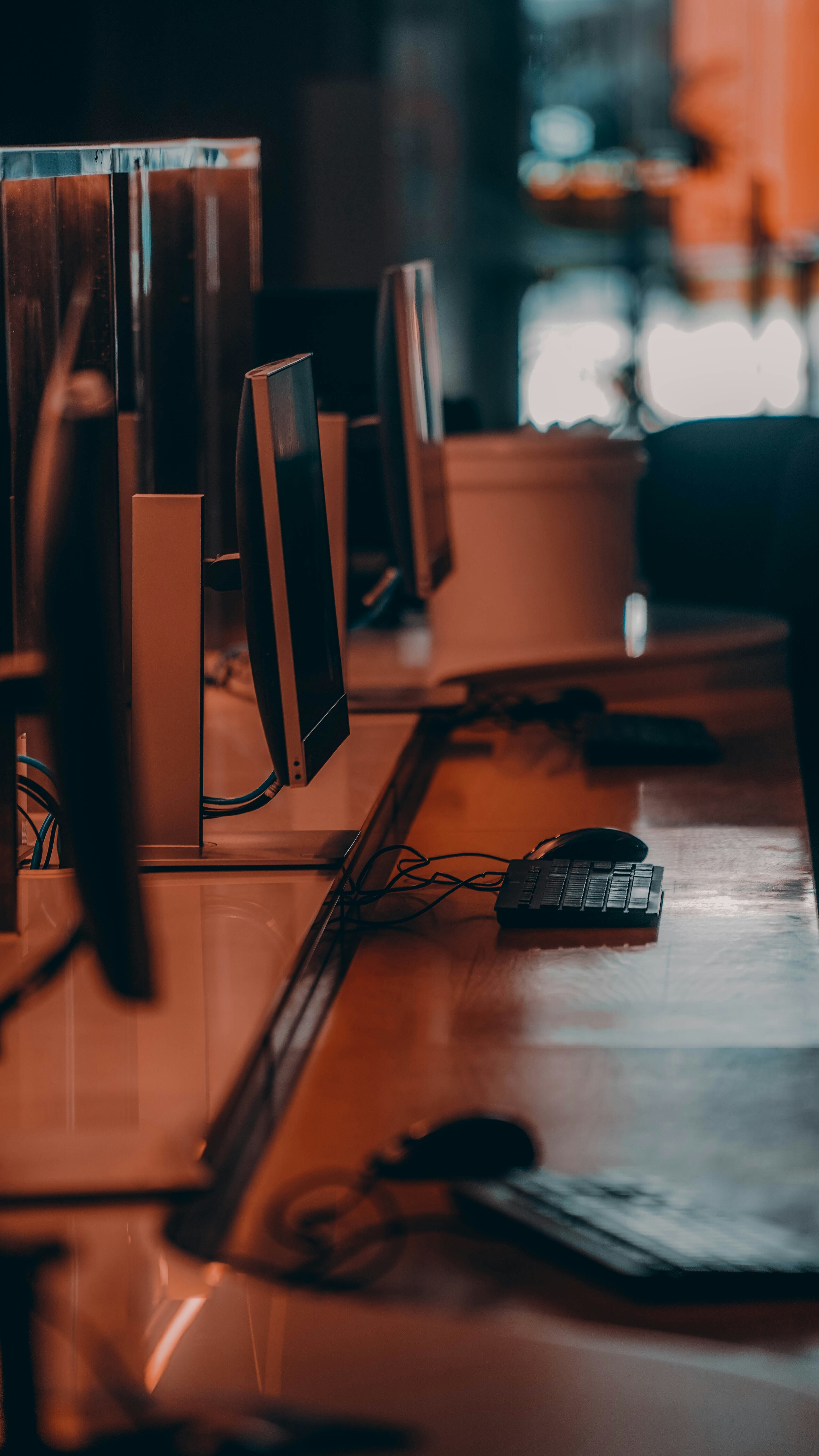 a desk with a computer monitor and keyboard on it