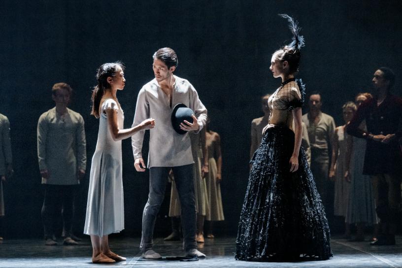Confrontation between dancers in contrasting costumes in Akram Khans Giselle.