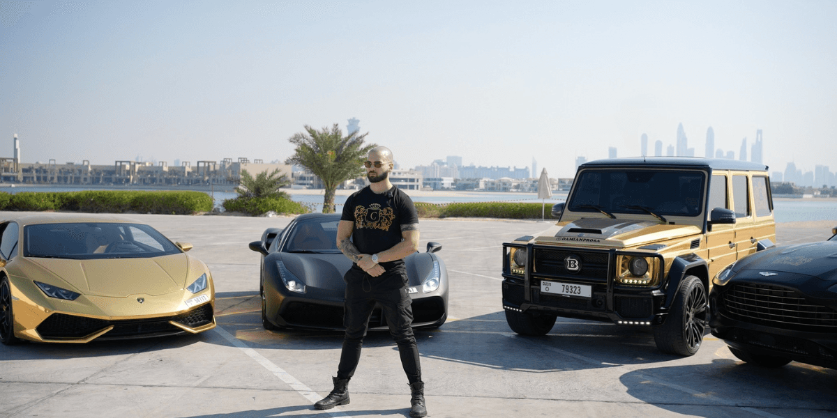 "Damianos Prosalentis, founder of Conclavio, stands confidently beside luxury cars, representing entrepreneurial success and digital business empowerment."