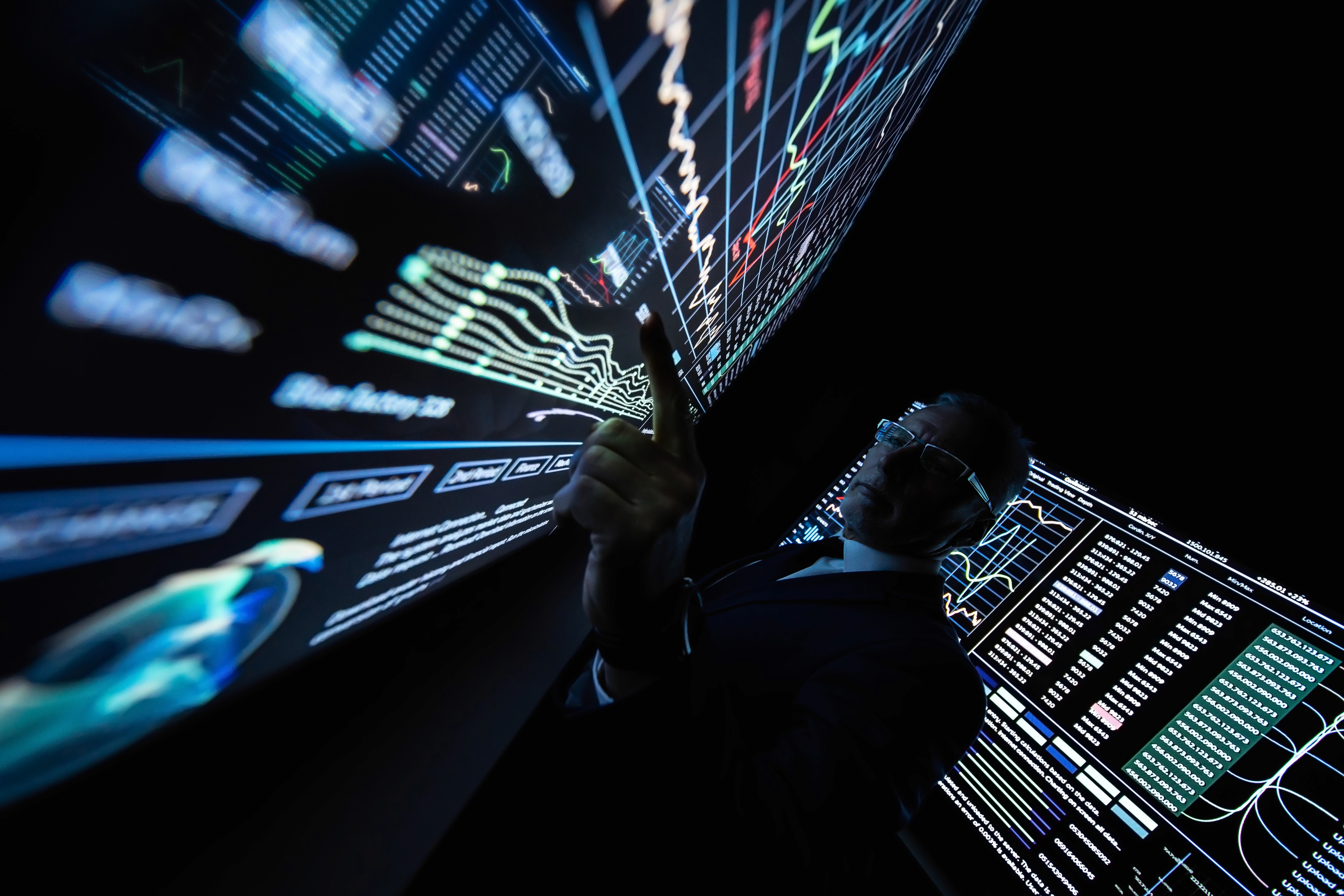 Data dashboards across multiple screens, illustrating complex performance analysis in SaaS marketing environments.