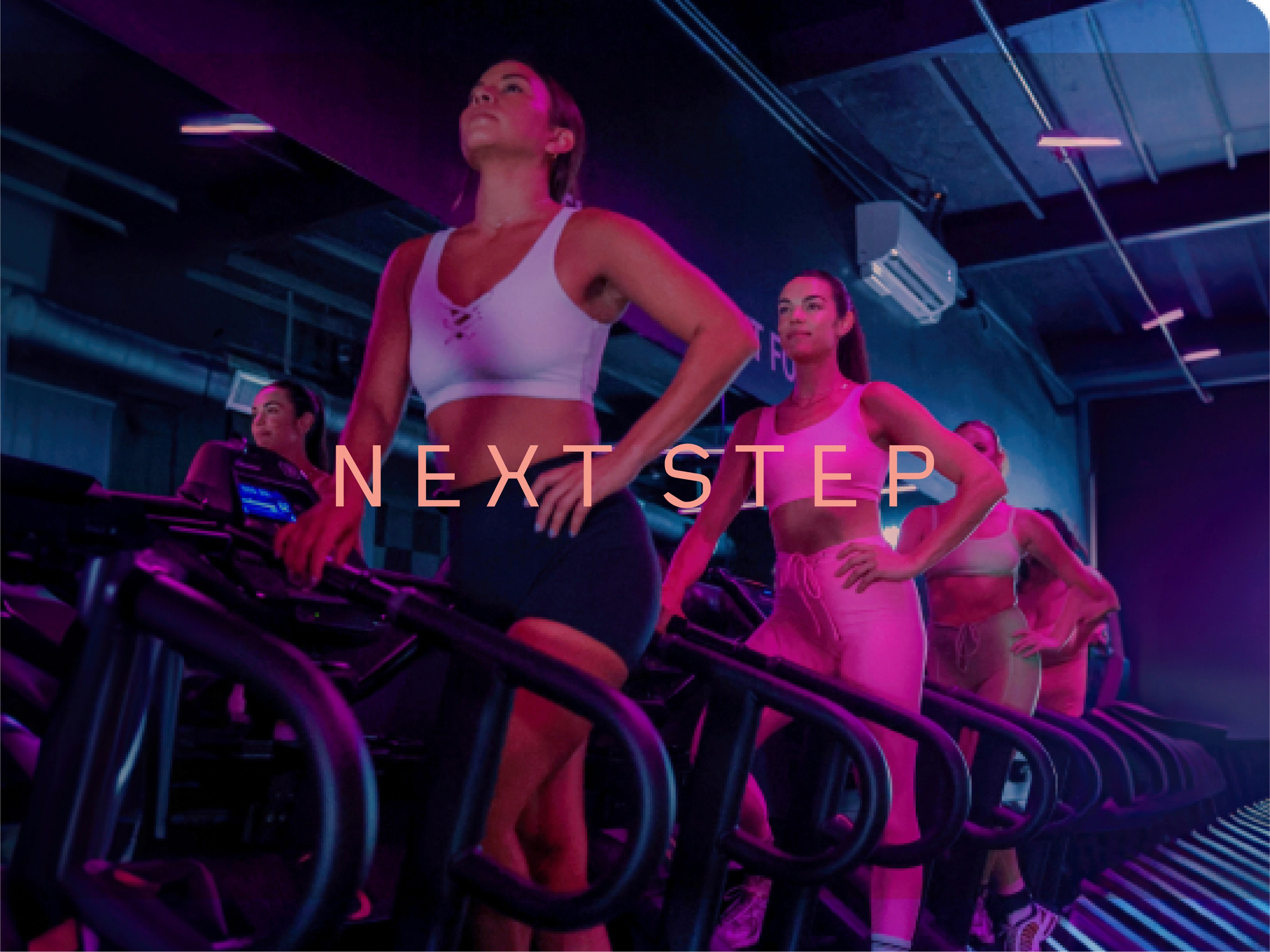 women working out at train bunda on stair machines