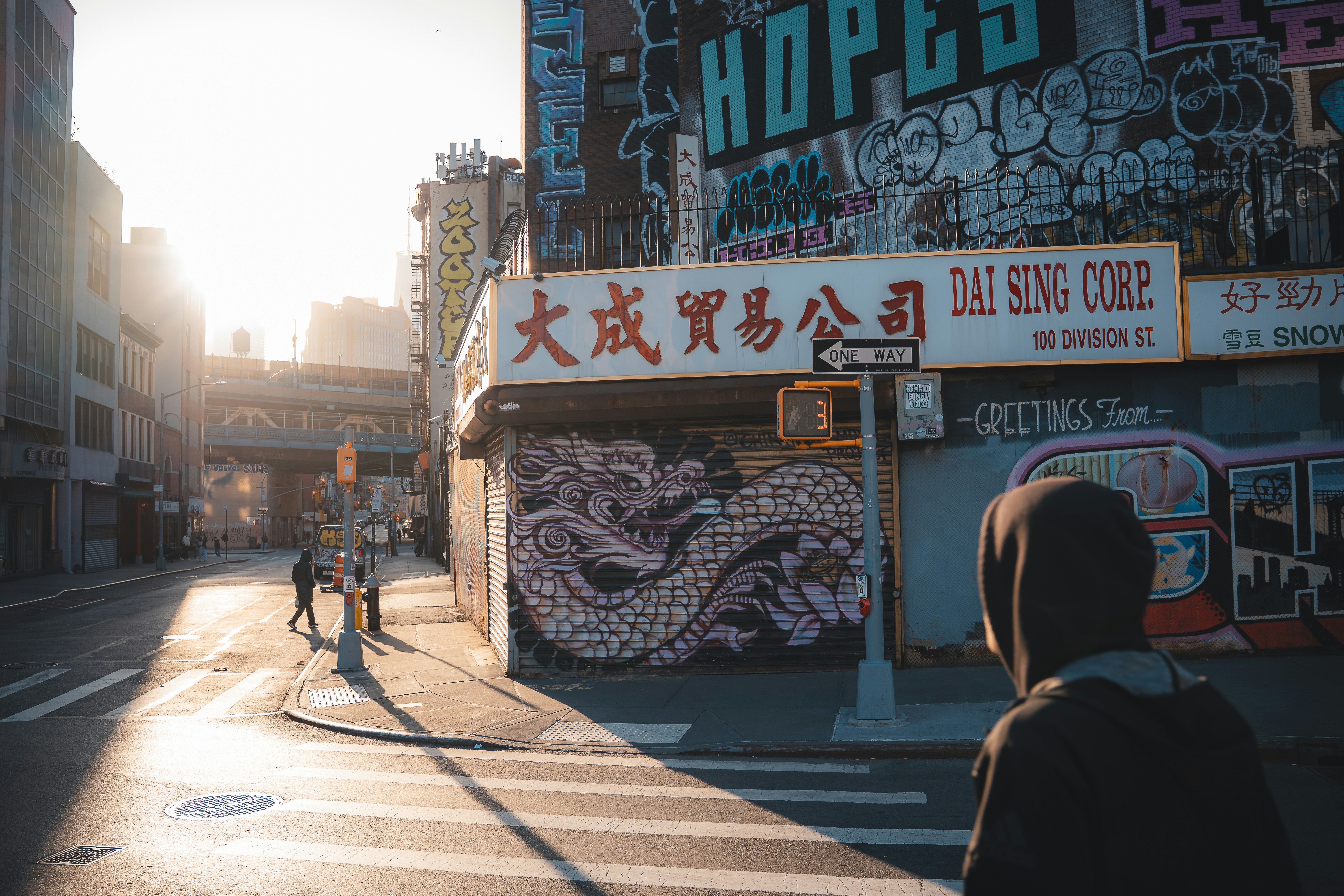 Street scene in a city with buildings and graffiti.