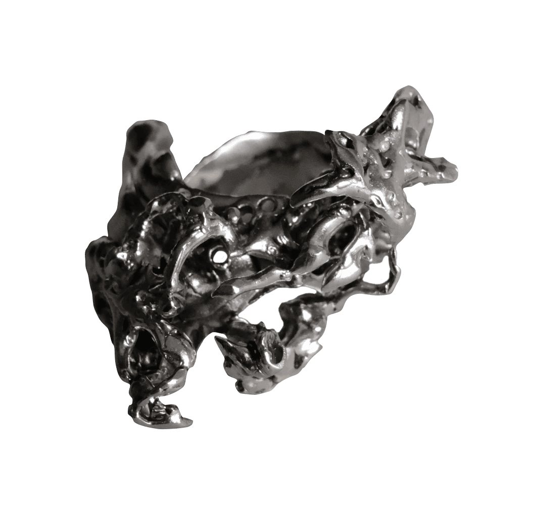 Sculpted silver ring with rough, uneven surface