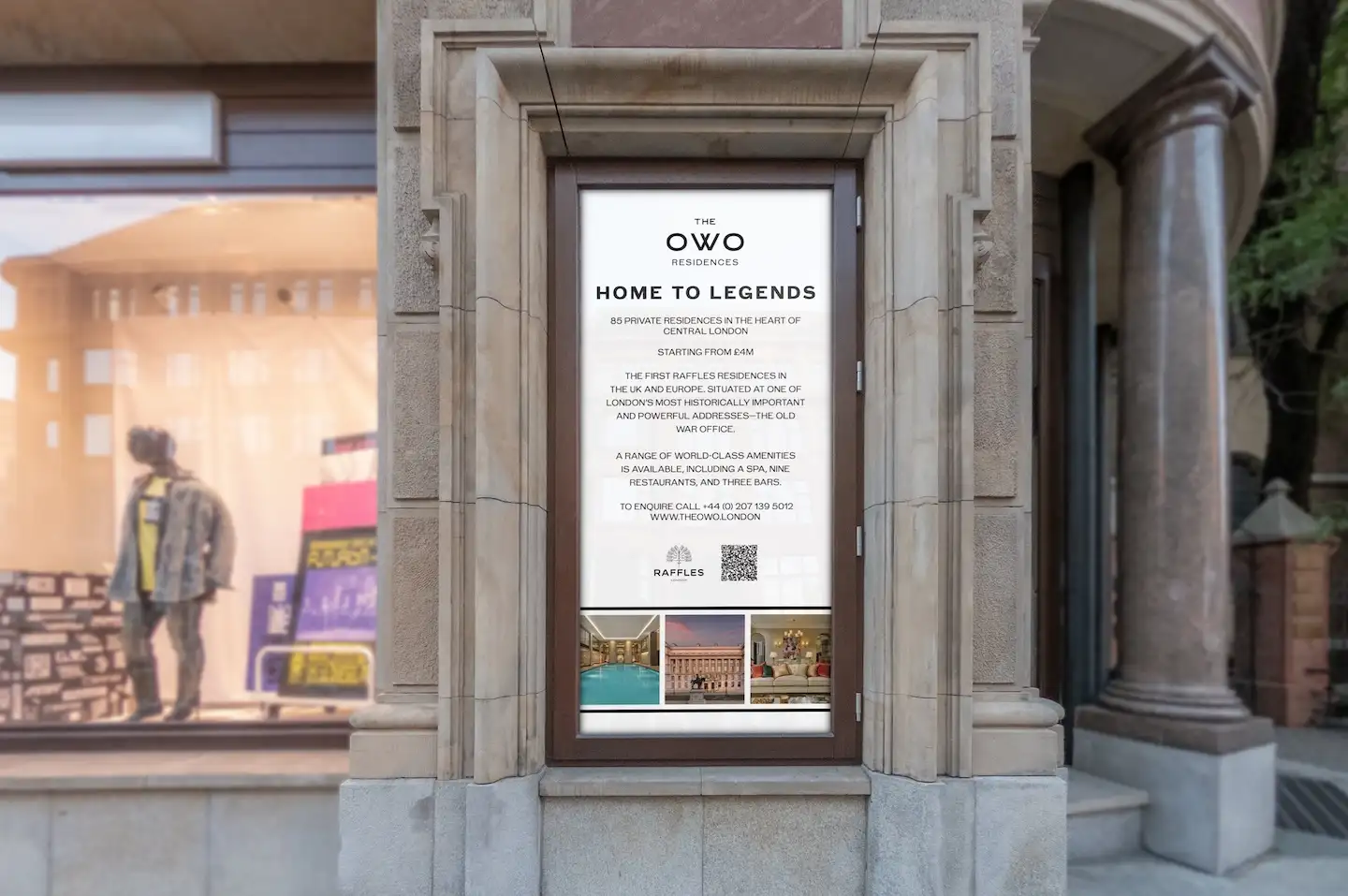 Large street-side digital poster promoting The OWO Residences with premium messaging about private homes in Central London.