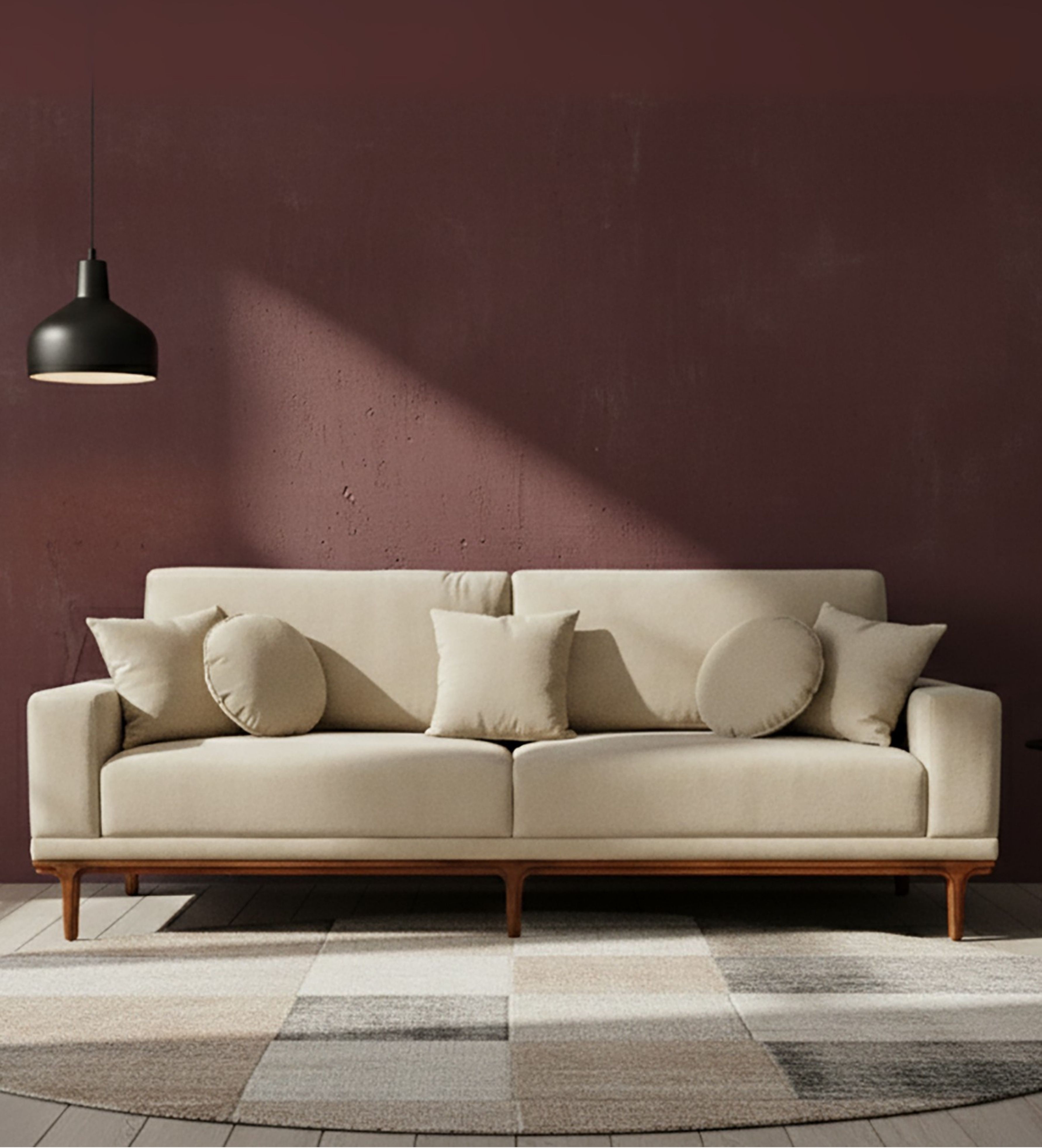 Cream upholstered three-seater sofa with round bolster cushions and wooden base