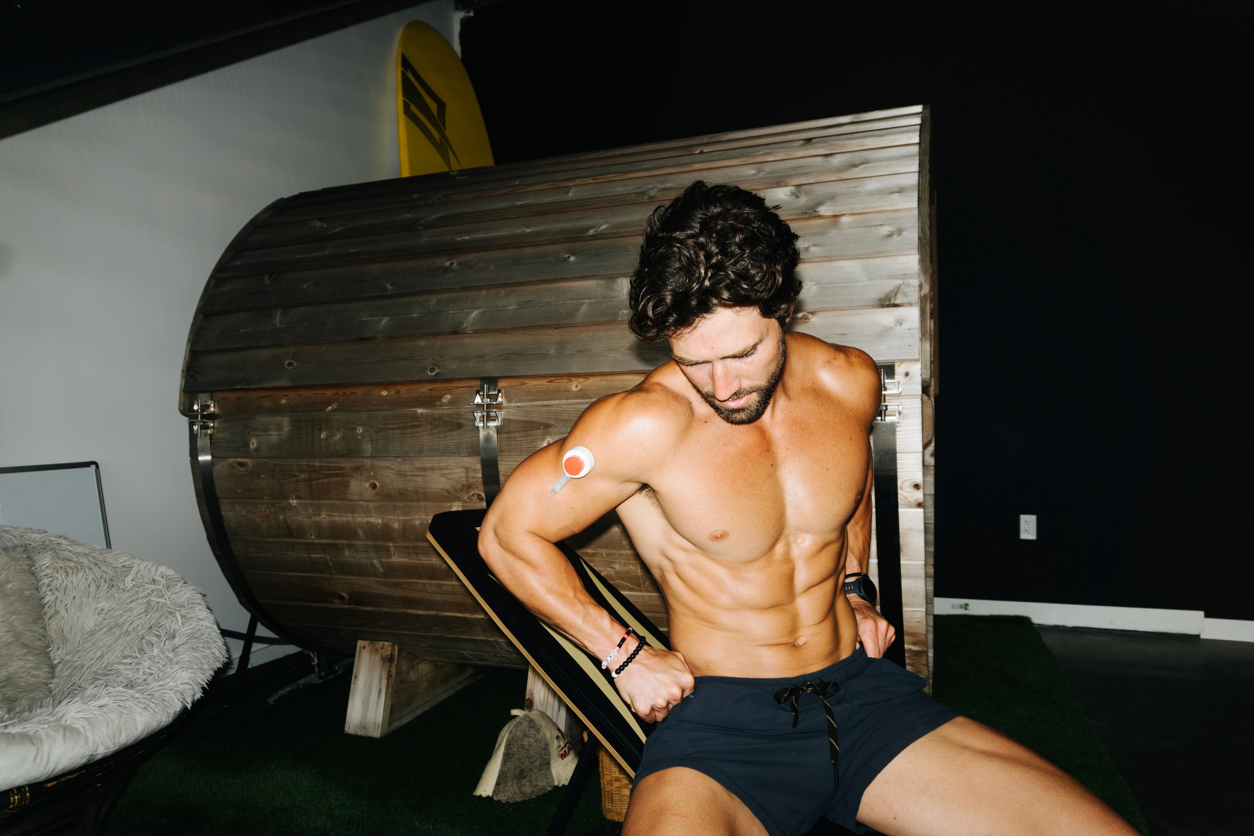 Smiling woman with clear glowing skin, doing the rythm at home blood collection representing healthy skin and internal health