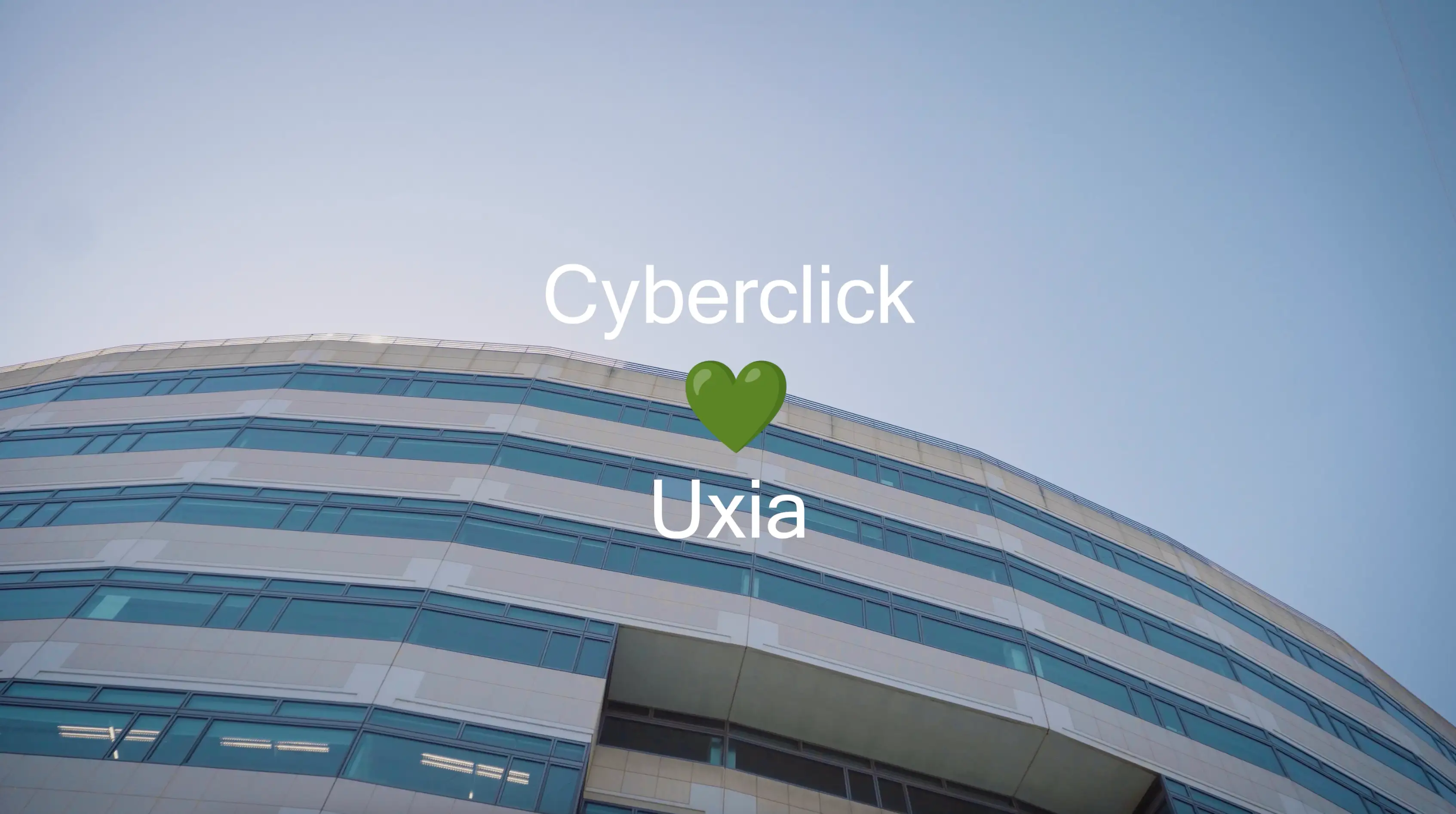 A blue-and-white tram stops at a street station in a city with brick buildings, shops, and people waiting. People gather nearby as bicycles are parked under sunny skies and leafy trees.