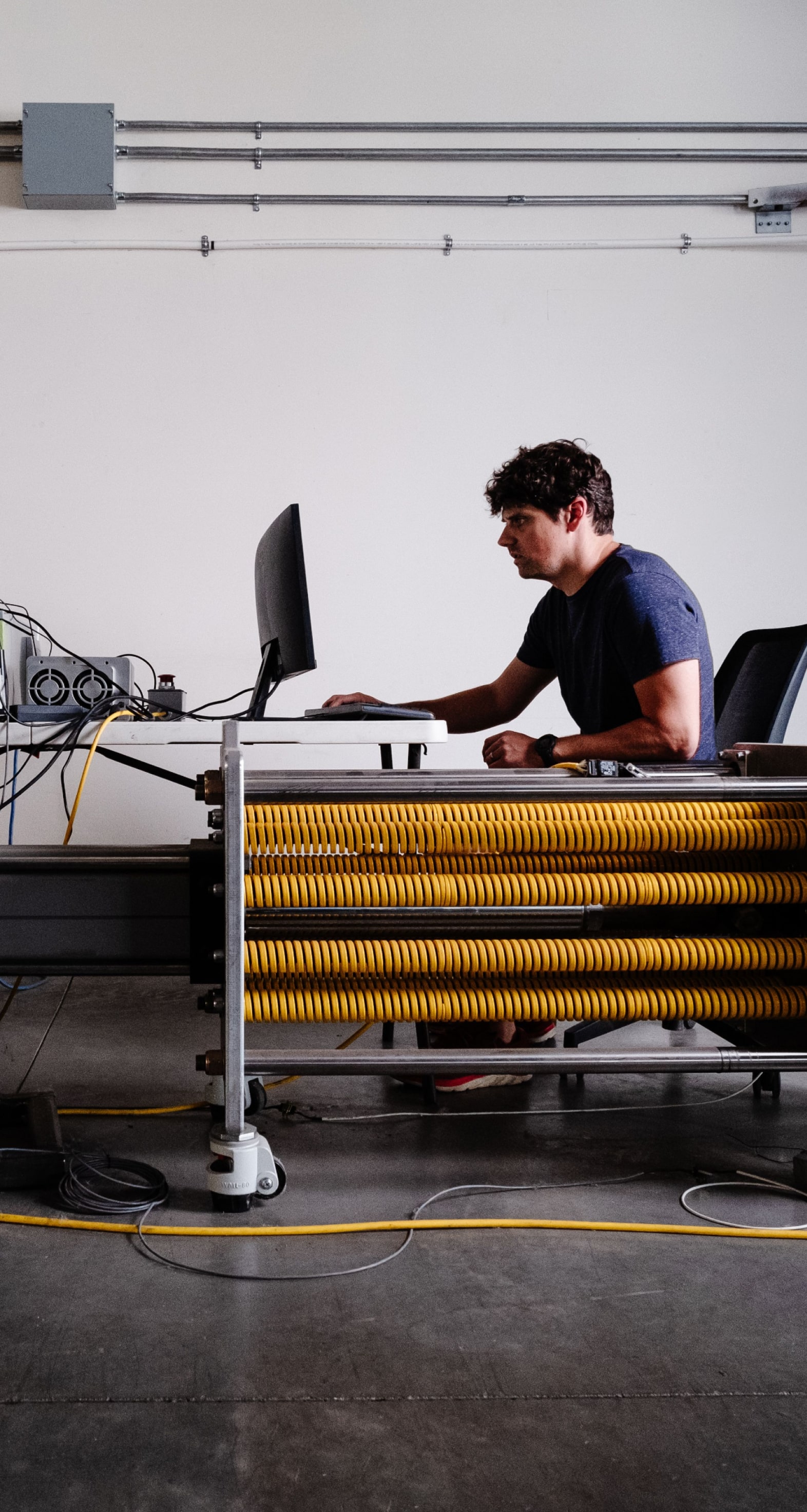 Man sitting at computer in warehouse