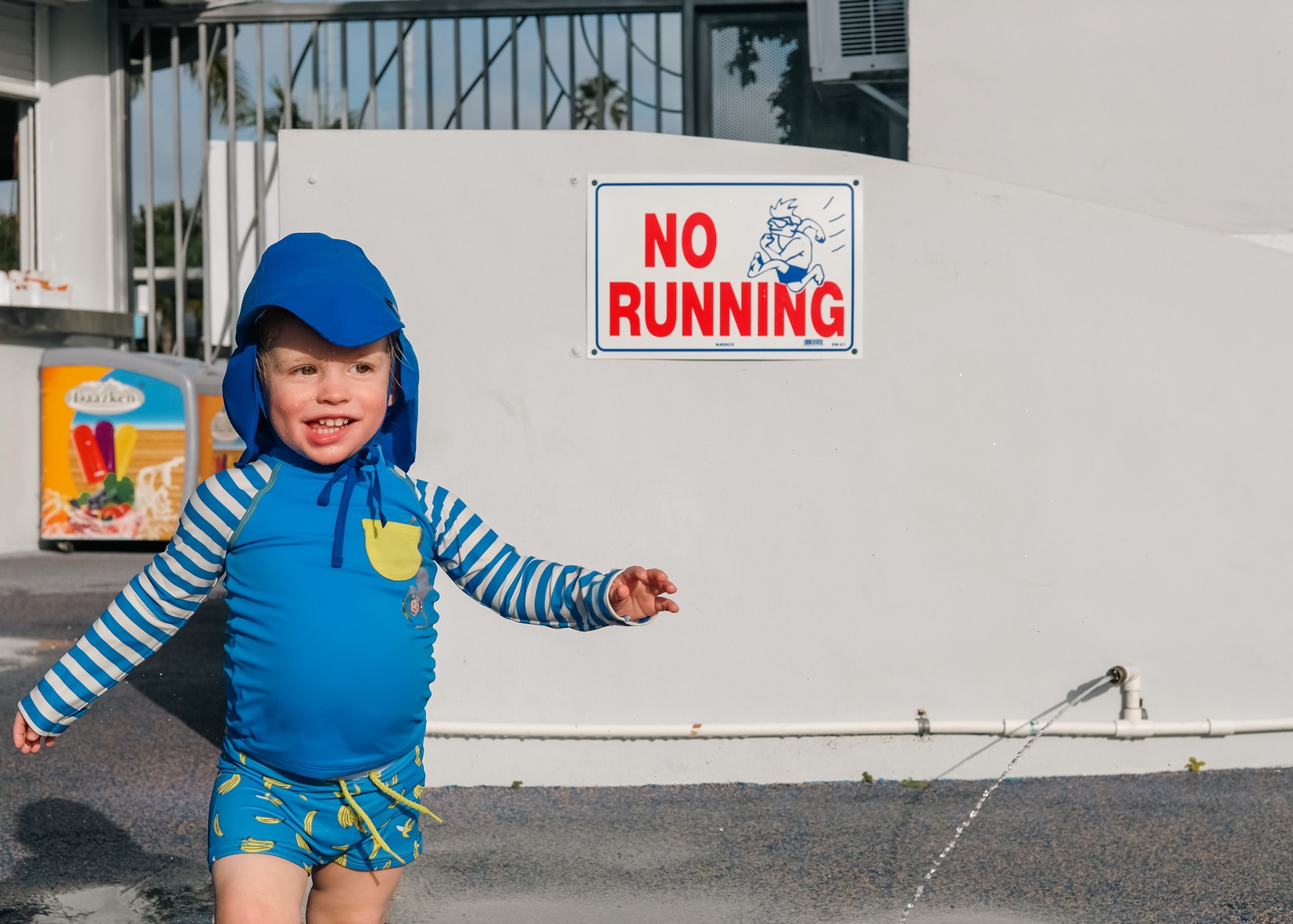 toddler-boy-outside-no-running-sign-katt-jones-photography