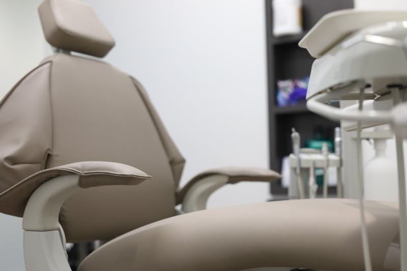 an empty chair in a dentist office