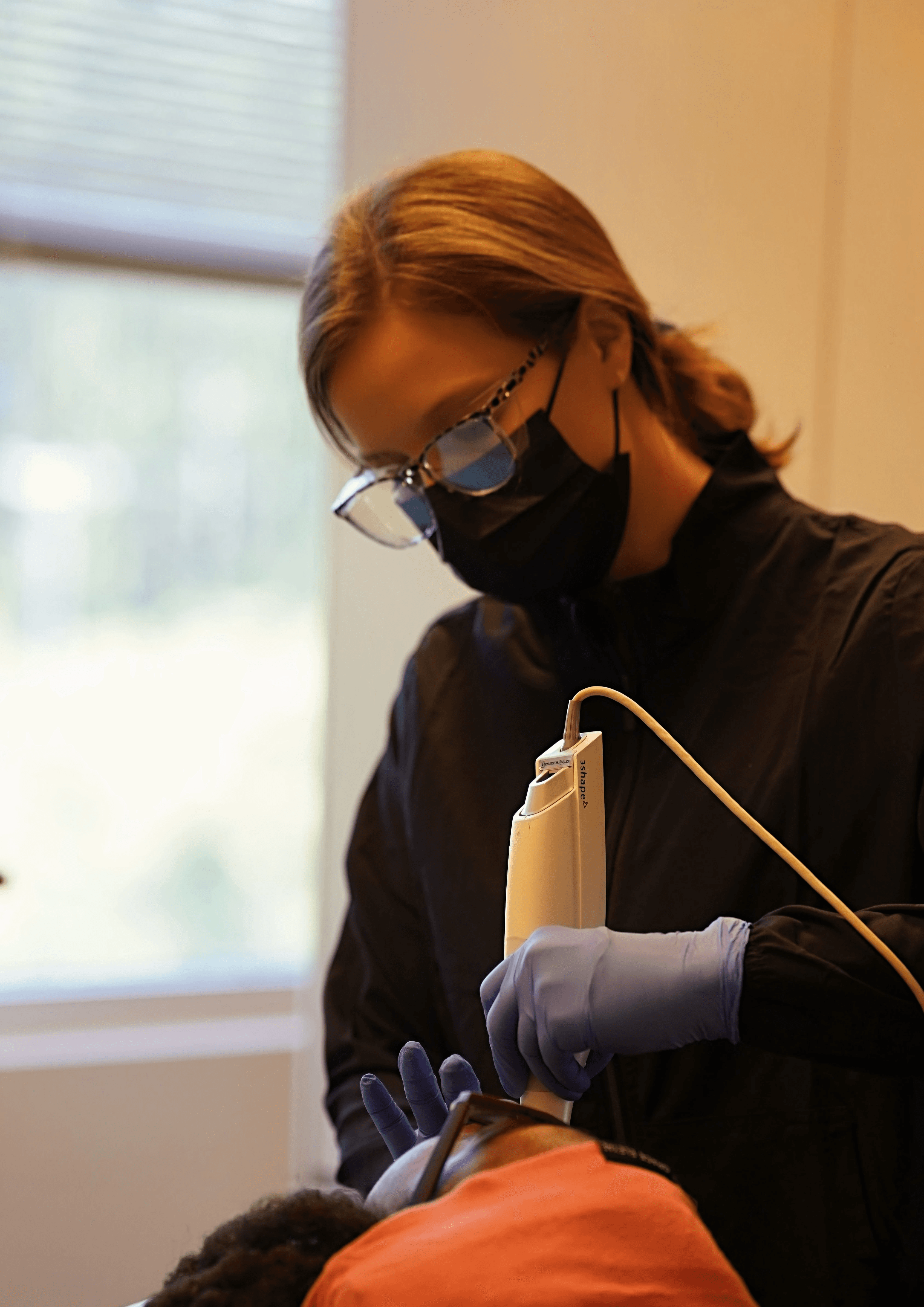 dental assistant assisting a patient
