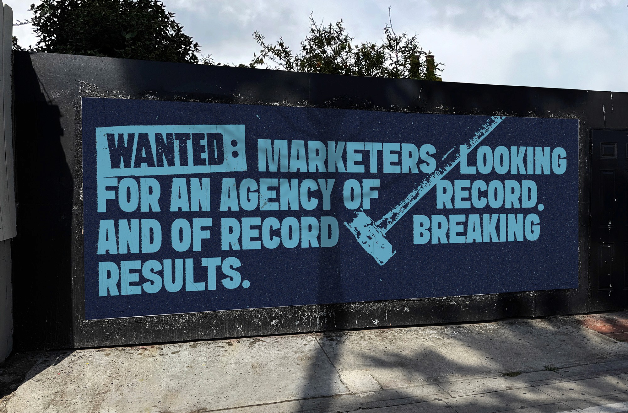 a cellphone leaning against a wall