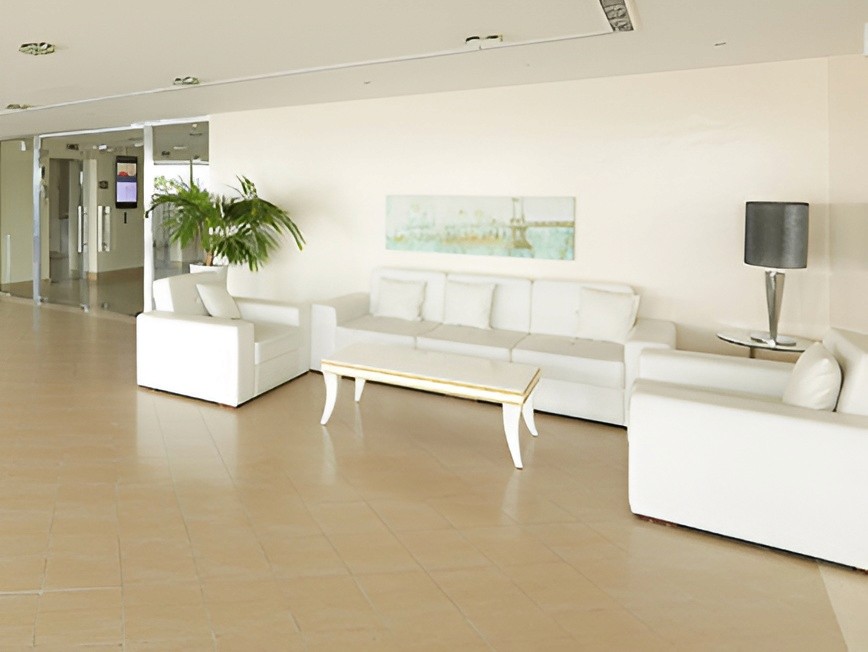 A lobby at Lakeside Tower featuring large mirrors along the walls.