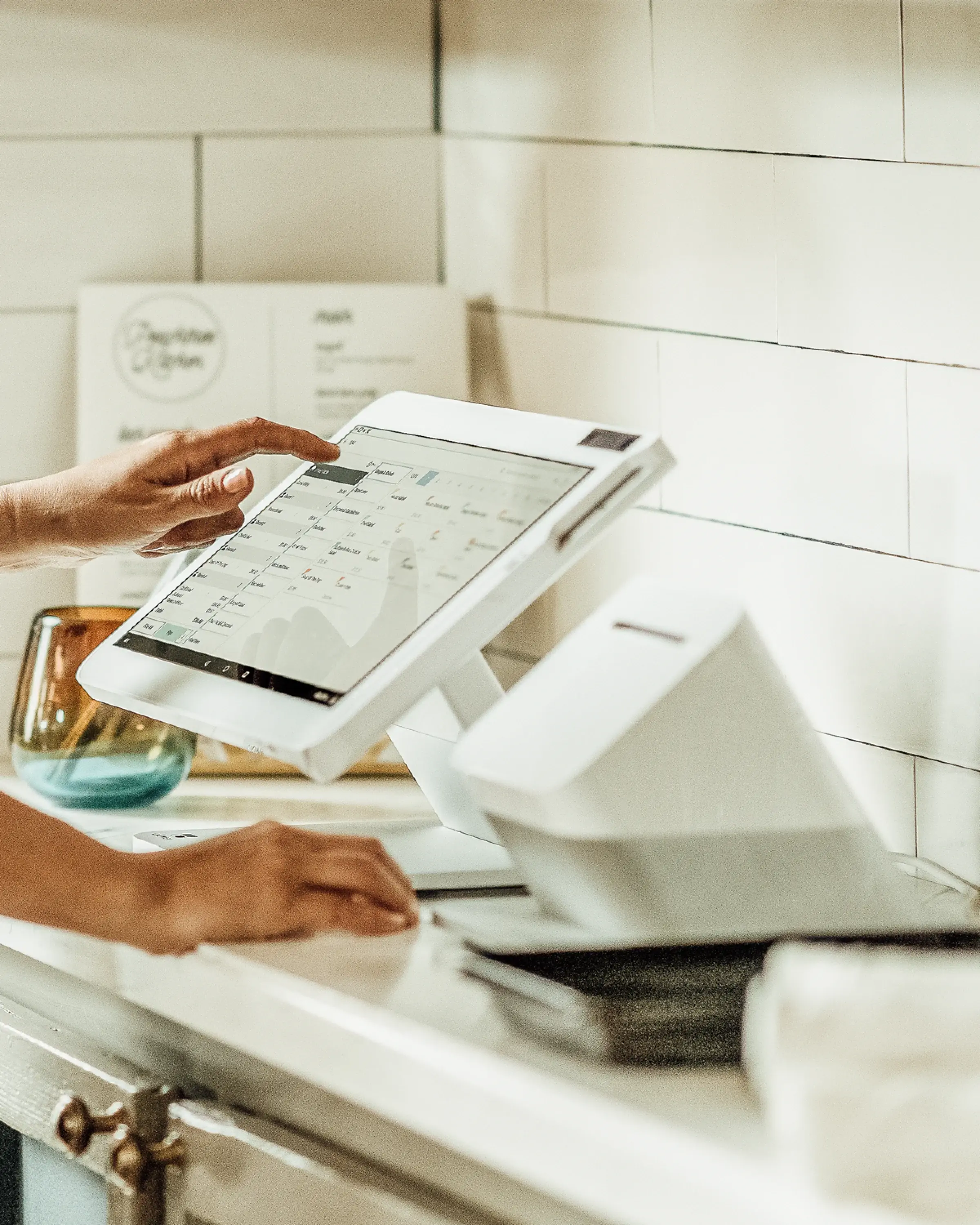 woman using a station solo on back of the kitchen countertop