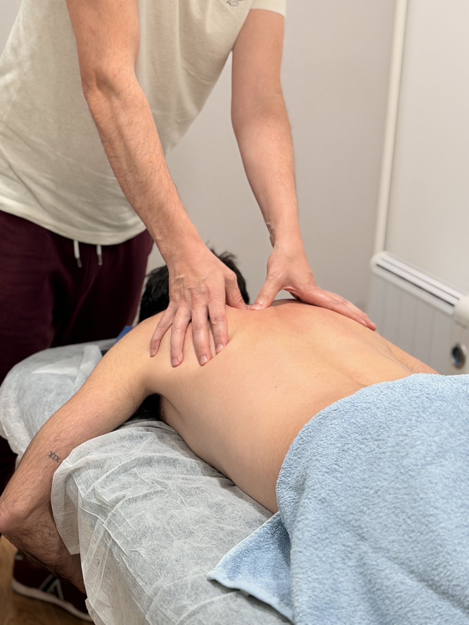 man massaging woman's body